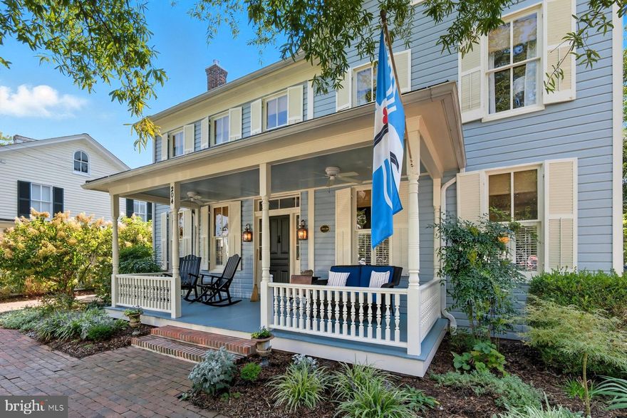 Step into history at the Thomas-Kirby House (c.1860), a charming renovated colonial in the heart of town with picturesque street views toward Saint Michaels Harbor. This light-filled historic residence showcases beautiful hardwood floors, two staircases, detailed millwork, and rich wood accents throughout. The welcoming foyer with its 'Seaport' hand painted mural wallpaper opens to a cozy study with fireplace and custom built-ins. The comfortable dining room flows seamlessly into the updated kitchen, appointed with a new center island, upgraded features and appliances. A double-sided fireplace serves both spaces, adding warmth and character. The light-filled living room, complete with its own fireplace and entertainment center(which conveys), opens through French doors to an extended brick patio, perfect for indoor-outdoor living. Upstairs, the stunning primary suite with its cathedral ceiling, offers large built-in wardroom space, gardens views, a private balcony, and  beautiful ensuite bath featuring a clawfoot tub and glass-enclosed shower. Two additional large guest bedrooms share a full bath with a luxurious steam shower, and a conveniently located second-floor laundry room completes this level. Outside, a charming brick footpath winds behind the home, connecting to an off-street brick driveway. The private backyard with its new cedar shed provides a tranquil retreat with mature trees and lush landscaping, while benefiting from the extended view into St Mary's Square.  With its historic charm, modern comforts, and extensive renovations made by the current owners, this home offers the perfect opportunity to enjoy the best of Eastern Shore living.
*encapsulated crawlspace and attic; new American Standard Platinum 18 SEER System; Aprilene whole house dehumidifiers (2 units); complete restoration and painting of interior and exterior are just some of the Upgrades