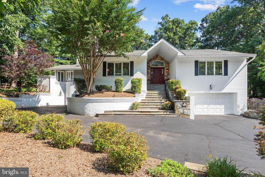 Welcome home to this thoughtfully designed & meticulously maintained contemporary home (mostly 1 level living!) in the desirable Lexington Estates neighborhood of Great Falls, Virginia.  Situated on a private 0.72-acre lot, the property is surrounded by lush landscaping, creating a backyard oasis—complete with a Koi pond, patio, putting green, expansive sun deck with Trex decking, and in-ground pool.  This home offers over 4,000 square feet of finished living space mostly on one level including main level primary suite. It features 6 spacious bedrooms, 4 full bathrooms, 2 fireplaces, a 2-car garage and 1.5-car garage.

A stately entrance welcomes you with stone steps, a mahogany front door, and a stacked-stone façade. Inside, the expanded foyer with a raised ceiling sets the tone for the striking interior. The sun-drenched living room features dramatic vaulted ceilings, tall windows, and a stone-stacked gas fireplace. The adjoining gourmet kitchen is a chef’s dream, showcasing flat-panel cherry cabinetry, granite countertops and backsplash, stainless steel appliances, two sinks, and a generous island with bar seating. The adjacent dining area offers a second stone-stacked gas fireplace and provides the perfect open setting for hosting.

From the kitchen, an open loft area provides flexible space for an office, game room, or playroom. A bright octagonal sunroom—part of a thoughtful addition—leads to the stately main-level primary suite, a private retreat designed for one-level living. The suite includes tranquil views of the pergola and fenced backyard, a large walk-in closet, and a spa-inspired bathroom featuring a skylight, custom circular double vanity, new soaking tub, and oversized glass-enclosed shower. The main level also hosts three additional bedrooms—perfect for family, guests, or a home office—ensuring that the majority of bedrooms are easily accessible. One bedroom includes a private en-suite bath, while a second full hall bath has also been tastefully updated. A spacious family room with a wet bar, beverage fridge, and ice maker offers the ideal space for entertaining and relaxing.

Finishes throughout include hardwood flooring, terra cotta tile, skylights, plantation shutters, recessed lighting, organizational closets, and Andersen® windows—attesting to the home’s exceptional craftsmanship and care. The fully finished lower level features a welcoming mudroom with custom cubbies, two additional bedrooms, a renovated full bath, a walk-in storage closet with built-in shelving, and a large laundry room with utility sink, cabinetry, and dual dryer hookups.

Conveniently located just one stoplight from Route 7, this property offers easy access to the vibrant centers of Tysons, Reston, and Great Falls Village, as well as nearby parks, Riverbend Country Club, Wiehle-Reston East Metro and Dulles Airport.   Come and see this entertainer's dream home  in the heart of Great Falls.