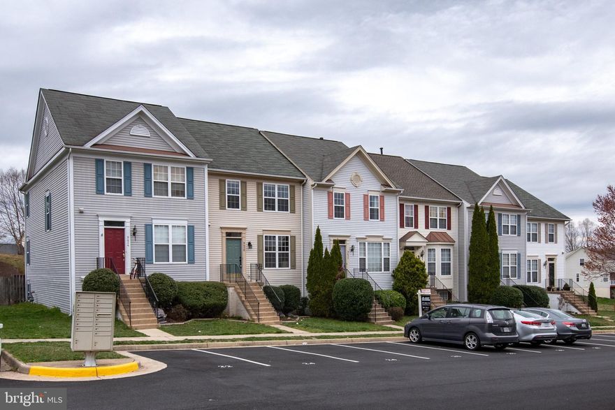 **ALL OFFERS DUE SUNDAY 4/14 by 8pm**Welcome home to this well-kept, spacious yet cozy 4BR town home in beautiful Blooms Crossing! Bump outs on all 3 levels create plenty of comfortable living space. Huge MBR offers over 250 sq. ft. with large walk-in closet, vaulted ceiling, and separate sitting area with huge windows to let in lots of natural light! Spacious master bath with French doors includes dual vanities, and spa tub with separate shower. Separate spaces but with an open and airy feel - enjoy hosting and entertaining on the main floor with both a living and family room, large dining area, recessed lighting, half bath, and excellent closet space!Updated hall bath upstairs along with updated kitchen appliances, washer and dryer, and 2 assigned parking spaces!Large fenced yard with direct access to your finished basement that boasts an additional (4th) bedroom with full bath and excellent storage space!**Home is being sold AS-IS and inspections are welcome, for informational purposes only.**