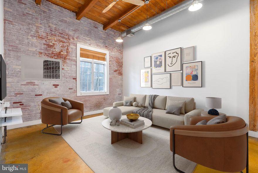 Welcome to Liberty Lofts, where urban living meets convenience in this spacious 1-bedroom, 1.5-bath condo in the heart of Northern Liberties. Boasting 18-foot ceilings, exposed brick, and a floating staircase, this loft is both stylish and functional. Natural light floods the open living area, complemented by recessed lighting and built-in shelving.

The modern kitchen features granite countertops, stainless steel appliances, a glass tile backsplash, and LED under-cabinet lighting. Upstairs, the oversized bedroom offers hardwood floors, ample closet space, and an en-suite bathroom with sleek finishes and built-in storage.

Upstairs, the expansive bedroom showcases hardwood flooring, abundant closet space, and an en-suite bathroom with refined finishes and built-in storage for your convenience.

This condo includes ONE DEEDED GATED PARKING SPACE—a rare find in this area. Additional amenities include a private storage unit in the building and a fitness center equipped with free weights, a treadmill, an elliptical, and yoga/stretching equipment, all maintained by the HOA.

Located in a prime Northern Liberties location, enjoy unparalleled walkability to local favorites like Honey’s Sit n Eat, Café La Maude, North Bowl, SIN, Figo, and Green Eggs Café, as well as convenient shopping at Target and Acme. With quick access to public transit, I-95, and the Ben Franklin Bridge, this is city living at its finest!

Some photos are virtually staged.