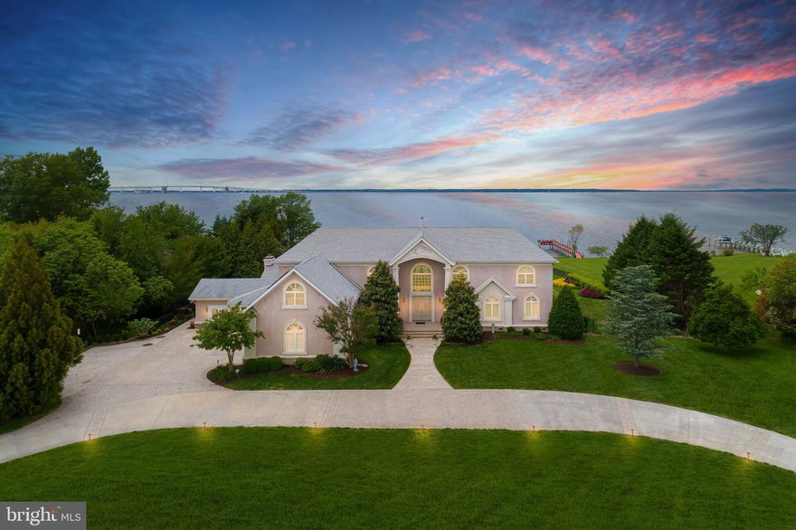 Chesapeake Bay waterfront estate on Kent Island minutes to the Bay Bridge with over 8000 square feet of living space.  Embrace the spirit of comfortable living in this amazing property on the Eastern Shore of Maryland. Commanding views of the Bay and the Bay Bridge minutes to Annapolis. An impresive floating staircase and Italian marble foyer greet you as you enter your new residence. Gourmet kitchen,  elevator,  cherry hardwood floors, finished basement, Dog room,  three fireplaces,  library, screened in sun porch, 4-car garage and a master suite on the first level are just some of the features of this unique property.   Take the stairs or the elevator to your own "pub" on the second level with ample space for you and your friends to enjoy the sunsets. Large patios with built in fireplace and lots of hardscape and beautiful landscape. This home has everything you ever dreamed of...and so much more.  Vacation where you Live!