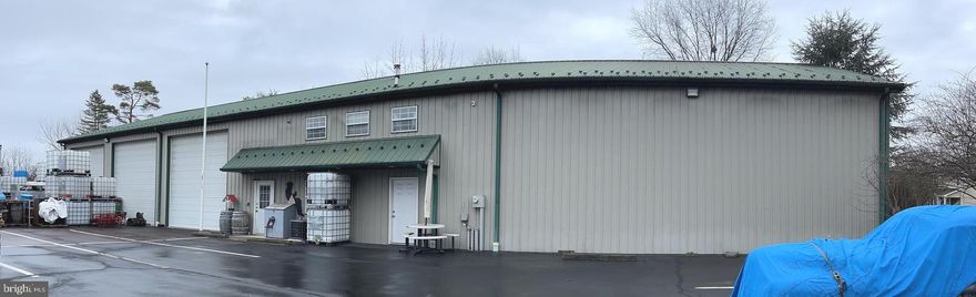 Available for lease or for sale: 7,000 SF Industrial/Flex building with 24 parking spots total. Three 10' x 15' drive-in doors, bathroom/shower/locker room and 20' clear heights. Small second floor office (@ 700 SF) with 3 Phase power, oil heat, public water and sewer.