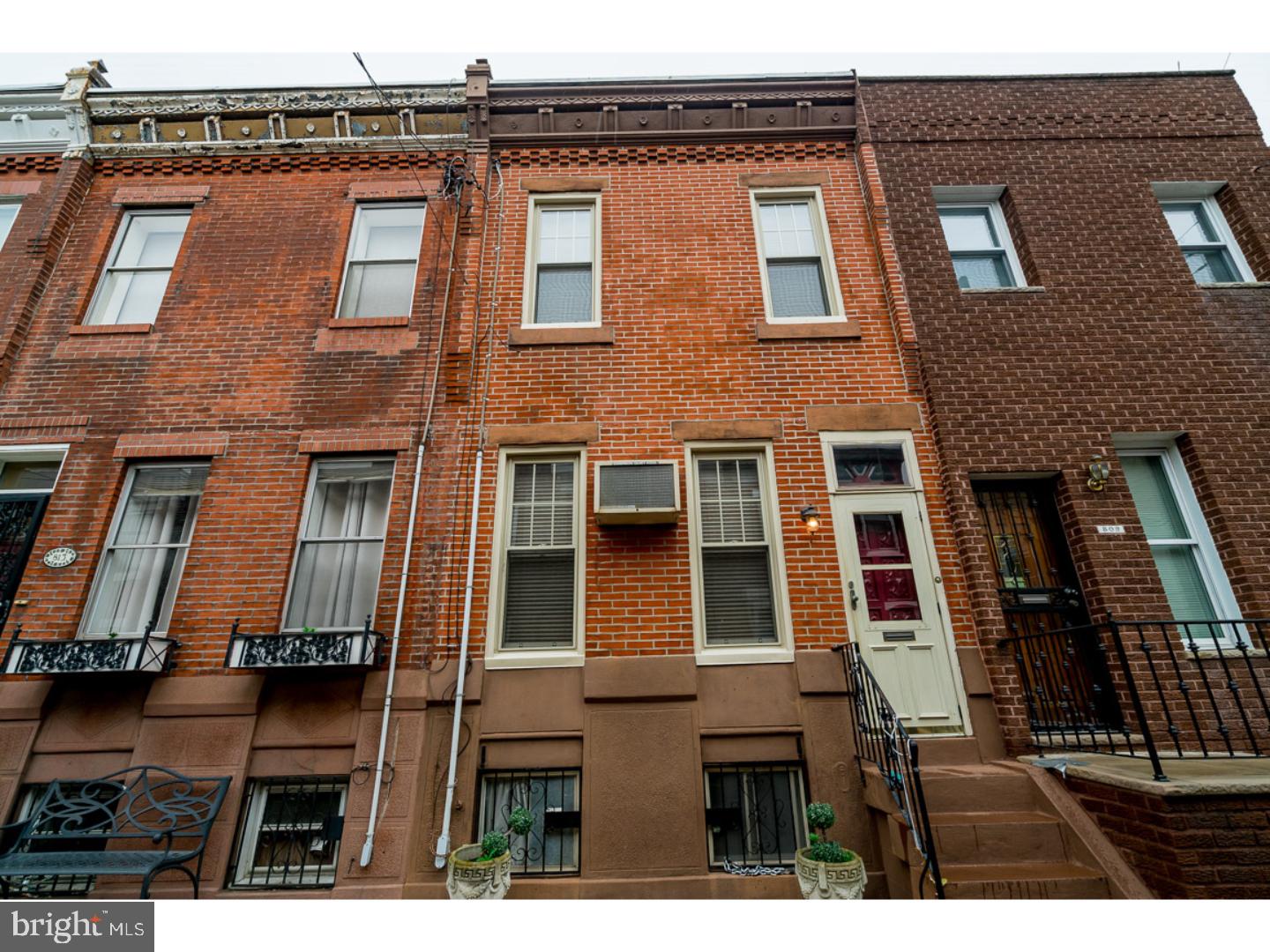 Step into this gorgeous Passyunk Square Home located in one of the nation's hottest zip codes and just blocks from all of the wonderful restaurants and shops that E. Passyunk Ave. has to offer, minutes from major highways and public transportation, and not far from Center City Philadelphia! Walk into a nice-sized living room with beautiful hardwood floors; dual color painted walls; decorative chair rail molding and an overall great space for entertainment; it also features a powder room and coat closet. Continuing through the first floor is a great dining room space with hardwood floors and beautiful trim and molding throughout. The kitchen features gorgeous granite countertops; beautiful tile backsplash; upper and lower light wood cabinets; a double-door refrigerator; gas range; garbage disposal; microwave; and Stainless Steel sink. From the kitchen walk out into a great yard space - great for summer grilling! The basement is partially finished. It can make a great rec room! It has a rear storage space and front laundry room with washer and dryer and the mechanical systems. As you walk up the second floor, marvel at the wood steps and the original iron railing. The second floor features three nice-sized bedrooms with hardwood floors and carpets and closet space! The full bathroom is beautiful with a large tiled walk-in shower. This home is a beauty! Pack your bags and move right-in!