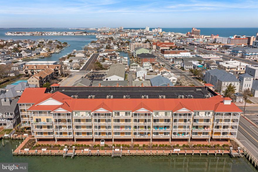 Welcome to Laguna Vista - One of the most Elegant & Exciting places- Downtown Bayside of Ocean City!  This unit was the Model unit and has been meticulously maintained.  Fresh Paint throughout and fully furnished with High End Details!  There is a Secure Elevator lobby with Private Garage parking.   Unit #107 Boasts a  unique layout featuring a primary bedroom overlooking the serene canal and its own guest wing featuring 2 bedrooms and 2 baths with private entrance!  Plenty of Storage, Washer and Dryer, Huge Granite Island with Seating and Spacious Dining Area.  Beautiful Living room with Fireplace to enjoy anytime of year! This is South Facing the canal and White Marlins' Weigh In @ Harbour Island Marina!  Enjoy one of the Most Famous  Events on the East Coast from your private Balcony! Indoor Year round pool and Exercise room.  Very secure and well maintained building. Great for large groups or families. Prime location in Ocean City, residents in this unit have easy access to the beach as well as various amenities and attractions within walking distance-  Rod & Reel @Harbour Island, FishTales restaurant and Marina, The Boardwalk and beach all within a couple of blocks!    Don't miss this Opportunity- You can rent or use for personal use, this unit has NEVER been  rented! Fully Furnished and Move In Ready!