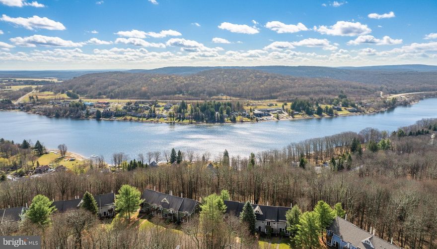 Experience year-round mountain-lake living in this beautifully maintained 3-bedroom, 3-bath townhome offering the perfect blend of comfort, convenience, and adventure. Ideally situated with private community lake access and direct ski slope access, this property is your gateway to Deep Creek’s most sought-after amenities. Recent updates include decks, siding, roof repairs, Anderson doors, bathroom vanities and toilets, electric baseboard heat, thermostats, appliances, stacked stone fireplace, and nest security/nest smart lock. This updated Villages of Wisp townhome won't last long, so call today to schedule your private showing!