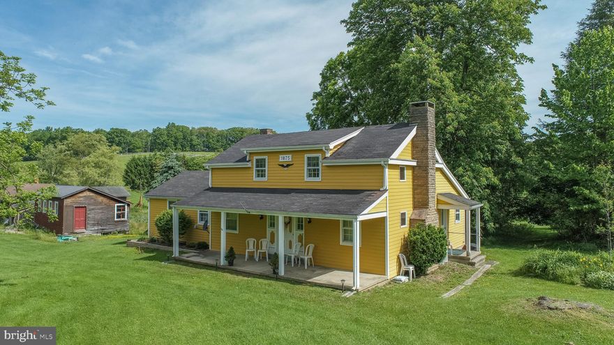 Make your Farmette dreams come true!  This 5 bedroom farmhouse sits upon  27 acres of beautiful rolling hillside right along Route 50.   Completely renovated in the early 1970's, the main floor features a family room, kitchen, primary suite with attached half bath, 2nd bedroom, and full bathroom.  Upstairs adds 3 bedrooms and a half bath.  Relax on the covered front porch and enjoy the beautiful scenery.  Multiple out-buildings provide plenty of storage for all the toys and/or a woodshop.  Don't wait, this gorgeous property won't last long!