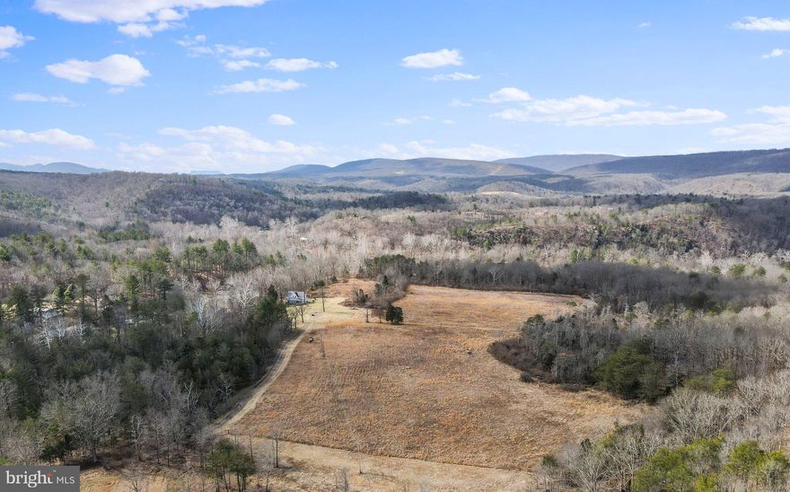 Beautiful 62+ acres with 1000 Ft of river frontage! Gorgeous surrounding mountain views. The Cacapon River is one of the cleanest rivers in the United States, and the river segment bordering this lot is no exception. Approximately 10 acres clearly visible along the river frontage that have been manicured over the years - free of brush, and flat. Land slopes gently up into the woods.