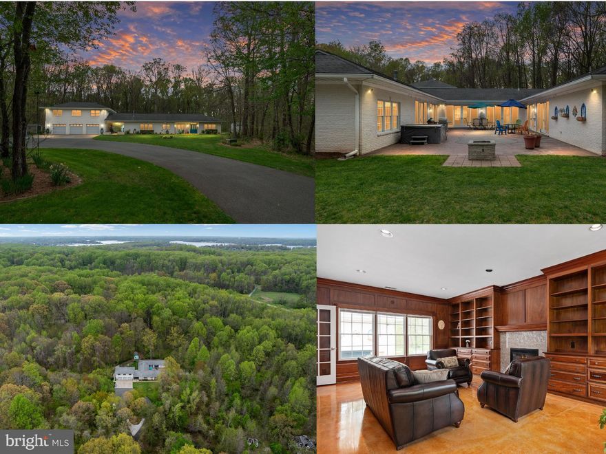You better hurry now...HUGE $75k price drop on this amazing one level custom built home! Come see it in person, you'll love it!  Tucked deep within 5 secluded wooded acres, this custom-built all-brick rancher offers a level of privacy, space, and versatility that is rarely found in Edgewater. Set well off the road and surrounded by mature trees in every direction, the property feels like a quiet retreat while still being conveniently located to everything the area has to offer. Designed for true one-level living, the main residence features four spacious bedrooms and 3.5 baths, with a thoughtfully designed layout that offers both functionality and  flow. The heart of the home is an oversized kitchen with a large center island, quartz countertops, gas cooking, double ovens, stainless steel appliances, and an expansive eat-in area with built-in cabinetry—ideal for everyday living and entertaining. Just off the welcoming foyer, a stunning mahogany library showcases floor-to-ceiling woodwork, custom built-ins, and a stone-surround gas fireplace, creating a warm and refined gathering space that is rarely seen. The home also offers a spacious formal dining room and an oversized family room that is filled with natural light.  The main living areas are complemented by expansive sliding glass doors that open directly to the outdoor living spaces, creating a seamless connection between the interior and the private courtyard beyond.  The primary suite is generously sized and includes a walk-in closet and a private bath with an oversized walk-in shower and neutral ceramic tile. Additional bedrooms are well-proportioned, including one with its own en-suite bath—perfect for guests or flexible living arrangements. Throughout the home, custom finished concrete floors add a unique, marbled aesthetic, blending durability with a distinctive design element that complements the natural surroundings. Outdoor living is equally impressive, with a private courtyard and an expansive stamped concrete patio—ideal for dining, entertaining, or simply enjoying the peaceful setting. The property is enhanced by extensive hardscaping, brick walkways, and multiple outbuildings, including a garden shed with electricity. The fully brick exterior extends to an oversized three-car garage, offering ample space for vehicles, hobbies, or storage. Above the garage, a beautifully finished two-bedroom, one-bath guest apartment with a full kitchen and living area provides exceptional flexibility—perfect for guests or multi-generational living.  With a circular driveway, abundant parking, and a setting that offers complete privacy, this property presents a rare opportunity to own significant acreage in Edgewater with a home designed for both comfort and long-term versatility.