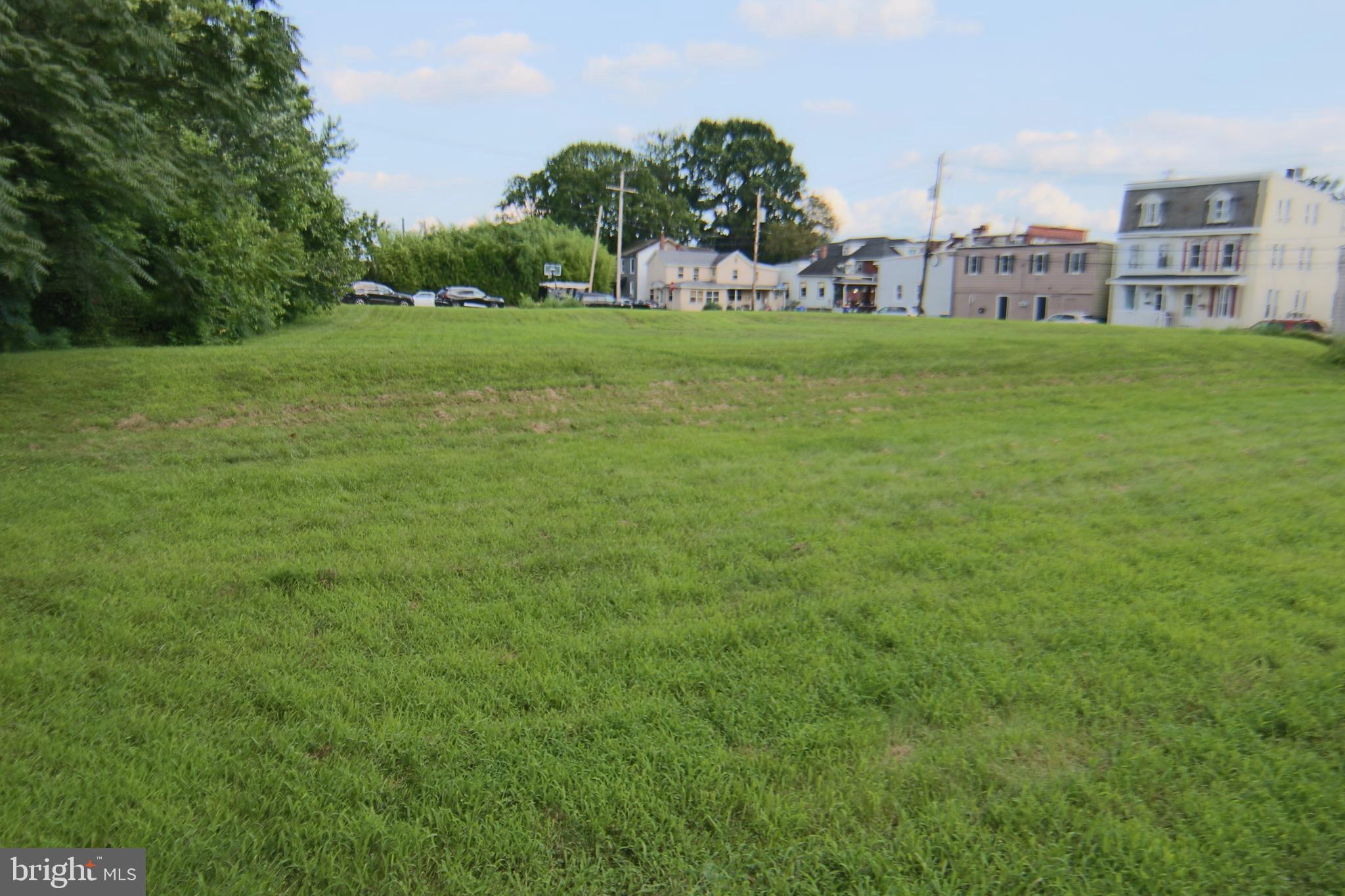 Rare Opportunity in Middletown Borough! This spacious .58-acre corner lot offers road frontage and sidewalks on two sides, located within the borough of Middletown. Public utilities available include water, sewer, electric, and natural gas. Currently zoned Residential R2, the property was previously zoned commercial and lot adjacent to property is zoned commercial C-2 —making a zoning change to Commercial C2 a viable option. The location, near Route 441 and the railroad, makes it ideal for a storage garage, contractor yard, or equipment parking, pending appropriate zoning approval. A rare find with exceptional potential for both residential or light commercial use!