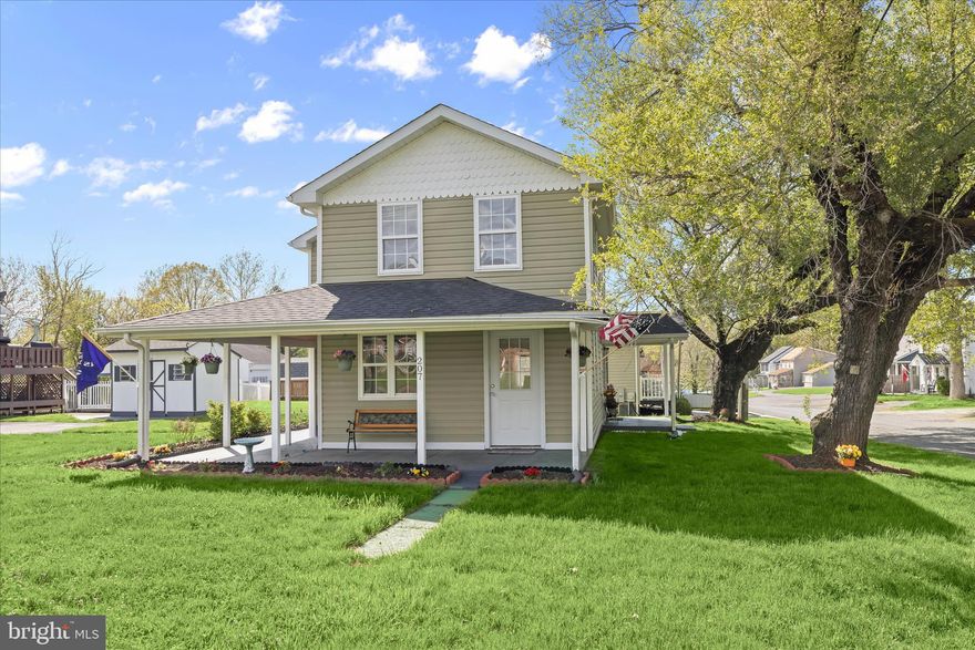 This North East 3-bedroom, 1.5-bath home offers charm from the moment you arrive. A wraparound porch overlooking the landscaped lawn welcomes you into the main living level, where a sunny living room with soft carpet creates a comfortable place to gather. The dining area features new hardwood flooring and its own separate entrance for added convenience.
The eat-in kitchen is functional and practical, complete with stainless steel appliances and a second entrance that makes everyday tasks like bringing in groceries simple.
Upstairs, the primary bedroom features a vaulted ceiling and ceiling fan for added comfort. The second bedroom is filled with natural light and includes a cathedral ceiling, while the third bedroom also offers a vaulted ceiling and ceiling fan. A full bath and a conveniently located laundry room complete the upper level.
The unfinished basement provides flexible space for storage or future plans to suit your needs. Recent exterior improvements include a new architectural shingle roof with transferable warranties, a LeafFilter gutter protection system, and a fully redone driveway with fresh grading and blacktop. The home also features a newly installed central air conditioning system, adding comfort and efficiency.  Additional Updates Include: lighting with new ceiling fans, refreshed kitchen and bathroom spaces with new paint, fixtures, and finishes, along with newly installed toilets and vanity. The HVAC system has been recently serviced, and new smoke detectors have been added for additional peace of mind. With easy access to I-95 and travel both north and south, this Folk Victorian-inspired home blends everyday comfort with classic farmhouse appeal.
Note:  Select interior photos have been virtually staged.