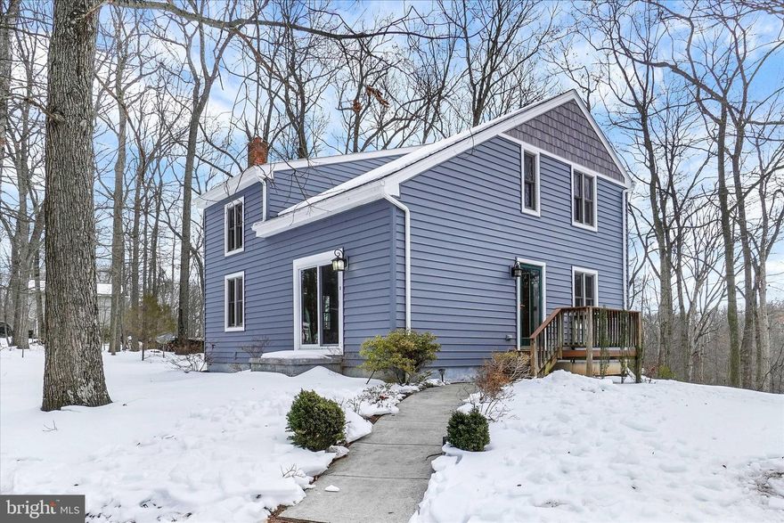 This charming Colonial-style home, thoughtfully renovated in 2025, offers a perfect blend of comfort and modern living. Nestled on a serene 1.5-acre lot, the property features a harmonious mix of cleared and wooded areas, providing a tranquil retreat surrounded by nature. The inviting interior boasts 1800+ sq. ft. of well-maintained space, including three spacious bedrooms and two full bathrooms, ideal for relaxation and privacy. First floor Main Bedroom ideal for one floor living!  Step inside to discover a cozy atmosphere enhanced by plush, new carpeting throughout. The heart of the home features a well-appointed kitchen includes essential appliances such as an electric oven/range, refrigerator, and dishwasher.  Cabinets have been re-faced and kitchen counter is brand new as well. The included washer, and dryer make daily living a breeze. There is pellet stove in the basement,  perfect for those chilly evenings.  The additional wood stove in the basement is not hooked up, but stays with the home. The full basement offers ample storage or potential for additional living space, as well as a finished family room.  The detached garage, with room for three plus vehicles has ample additional storage, adding convenience and functionality. Enjoy picturesque views of the surrounding trees and woods from your property, creating a peaceful backdrop for outdoor activities or quiet contemplation. Located in a rural setting, this home provides a perfect escape from the hustle and bustle, while still being accessible to nearby amenities. This property is not just a house; it’s a place to create lasting memories. Experience the warmth and comfort of home in this delightful residence.   All AC window units stay.  See Updates List in Documents. New siding 2022. New roof 9/2025. New carpet throughout and bathroom tile 10/2025. Kitchen Cabinets refaced NEW- 11/2025. New Kitchen Counter Tops 2026. New paint 11/2025. Deck and side porch rebuilt 8/2014.  New kitchen window & sliding door 8/2025.  Home is last house on this lane. Very private setting.