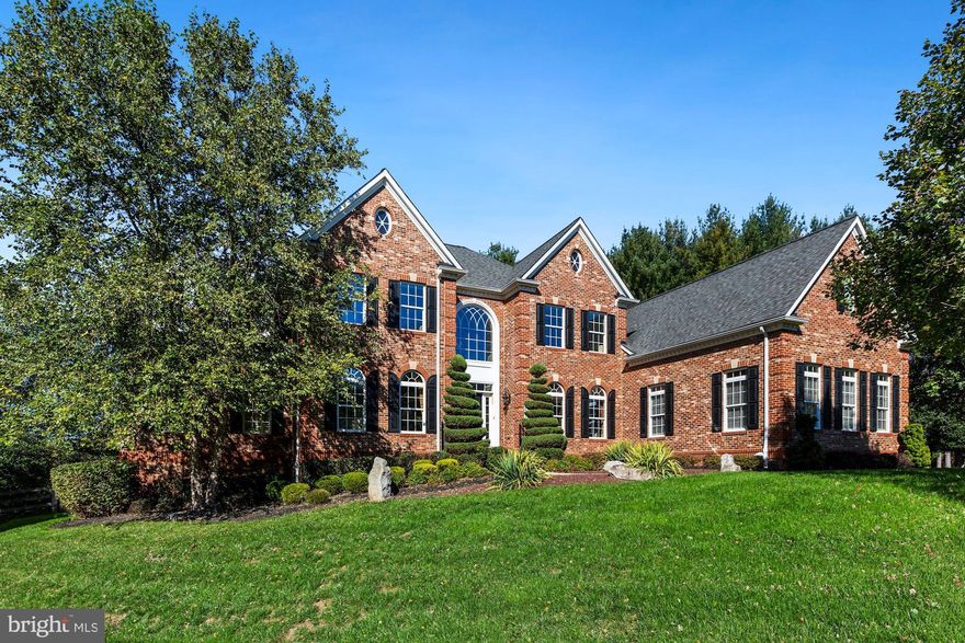 Fabulous... A RARE FIND!   This is the best of NV Homes!   The Clifton Park model is largest and most desirable floor plan in this exclusive Roberts Landing community of North Potomac.  This highly upgraded quality built home rests on the best location in the neighborhood. It is sighted at the end of a quiet cul-de-sac and backs up to acres of parkland with both quiet, private and serene views. Enjoy watching the sunset over the woods from your very private deck or from your very own balcony off the owners suite. The grounds cover 1.648 aces  with the immediate back yard  fenced. Upgrades like brick on three sides, hardi plank rear and trex decks are some examples of the quality you can expect with this fine home.
The floor plan boasts  of almost 10,000 square feet on three finished levels.  The upper level is accessed from the elegant waterfall staircase in the soaring entry foyer (or from the rear, family staircase from the kitchen). The home features 5 bedrooms and 4 full baths upstairs.  The Owners suite has a cove ceiling, a large siting area, a 3 sided cozy fireplace and even a walk in closet(that is 30 feet long!).  Two other bedrooms have private baths, the remaining two share a Jack n Jill bath. 
The main level has an open floor plan that is remarkably light and bright.  Both the Entry and the coffered Family room boast soaring two story elegance.  All other rooms are ten foot height. The kitchen is stunning with all Viking appliances ( 6 burner and oven range, cook top venting, microwave,  additional wall oven, dishwasher and refrigerator), warm maple cabinetry, a  granite 12 foot island, granite counters and a walk in pantry.  The kitchen is flanked by a large breakfast area overlooking the grounds.  Adjoining the kitchen area is the two story Family Room with lovely built in bookcases surrounding another fireplace to enjoy.   Off the Family room is a private den/office with it's own built in bookcase and French doors. The west side of the home has a large Sun Room with windows on three sides and a walk out to a balcony.  The generous Dining Room and Living Room are located on either side of the Entry. The floors are Brazilian Hardwood  (excepting the kitchen and Sunroom). The main level is completed by the attached side loaded three car garage with a mud room and a laundry adjacent.
The lower level is ideal for entertainment with a full granite wet bar (plus wine cooler, dishwasher), built in shelving and yet another fireplace to enjoy.  The Media room comes equipped with luxury seating for six and a big screen projection system.  There is also a full bath, an office (could be converted  into a bedroom) and a large work out area as well as ample storage.
Please view the 3-D presentation and the many stills...better yet make an appointment and come out to tour in person!....thanks Mike Fox