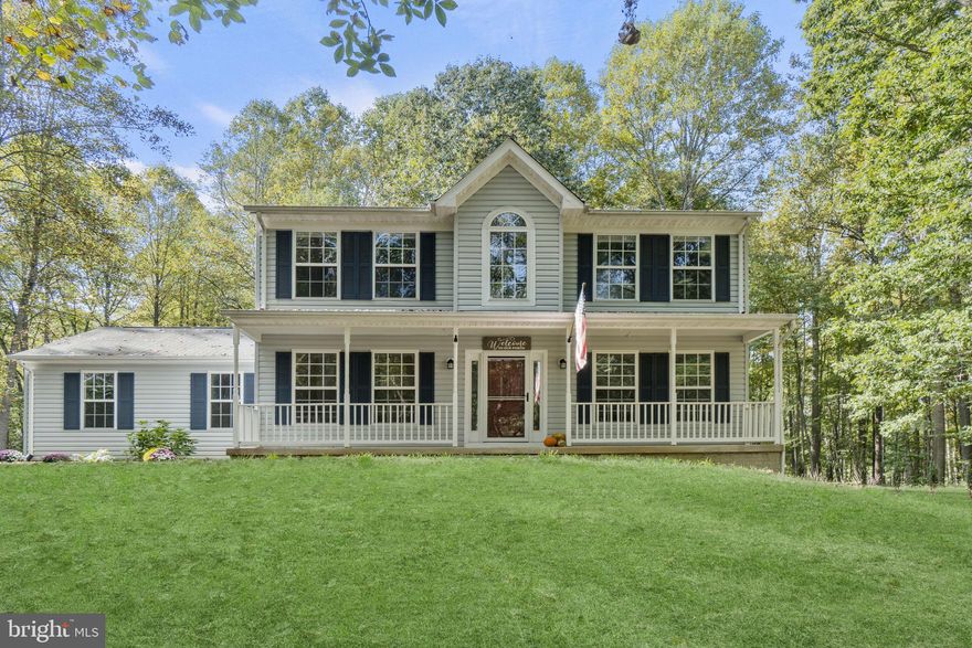 Experience tranquility with this home that sits on a sprawling 2-acre lot, complete with a picturesque tree-lined driveway leading to your secluded oasis. Delight in moments of serenity on the front porch, sipping your morning coffee or savoring a nightcap while immersing yourself in the soothing sounds of nature and the gentle caress of the breeze.

Boasting over 2,600 square feet across three immaculately finished levels, this home offers abundant space for your every need. The recently upgraded kitchen features top-of-the-line stainless steel appliances, ensuring a culinary experience that meets the highest standards.

Step into the expansive family room, which seamlessly extends to a spacious outdoor haven, perfect for both grilling enthusiasts and those seeking tranquil evenings by the fire pit.

The primary bedroom suite is a sanctuary of luxury, complete with double vanities, a sumptuous soaking tub, an invigorating shower, and a generously-sized walk-in closet. Two additional bedrooms on the second level, along with another full bath, provide comfort and convenience for all.

The basement reveals two beautifully finished rooms, offering endless possibilities to suit your lifestyle and desires. Don't miss the opportunity to make this exceptional home your own – come and explore it today! Check out the document section as the current owner had plans written up for a first floor remodel!