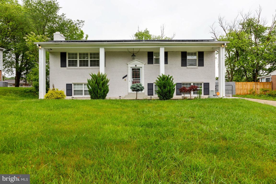 All brick split foyer offering 3 full and 1 half bath. beautiful wood floors and granite countertops. stainless steel appliances, ceramic tile backsplash, and new carpet on the lower level. Upgrades & renovations throughout. Updated lighting and 2 fireplaces. Covered patio and large back yard with a firepit & shed. Approximately 15 miles to Washington DC.