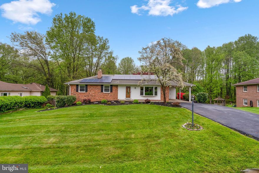 Welcome home to this amazing rambler in sought after Olney Mill on a fantastic lot! Gleaming hardwood floors grace the main level, including all three bedrooms! Beautifully updated kitchen features granite counters, stainless steel appliances, bright white cabinets, and a pass through providing sight lines to view the living room! The dining room is off the kitchen and includes a sliding door which opens to an expansive deck with a hot tub! Fabulous owner’s suite with walk-in closet, door to deck, and updated bath plus two additional generously sized bedrooms and full bath complete the main level. The walkout lower level is awesome! Spacious family room with brick surround wood burning fireplace to enjoy cozy winter nights! There is also a full second kitchen with table space and separate backyard entrance! The lower level also includes a half bath, laundry room, and plenty of storage space! The backyard is INCREDIBLE!! Huge open space for all your outdoor activities plus a designated fire pit area. This house backs to trees offering privacy and a scenic vista!! Take advantage of all the Olney Mill has to offer like the outdoor pool, tennis courts, multiple playgrounds, and walk/jog/bike paths! This location is near all of Olney's restaurants, shops, the Olney Public Library, Olney Skate Park, Olney Indoor Swim Center, and MORE!! A commuter's dream as commuter routes are close by! Don't miss this one!