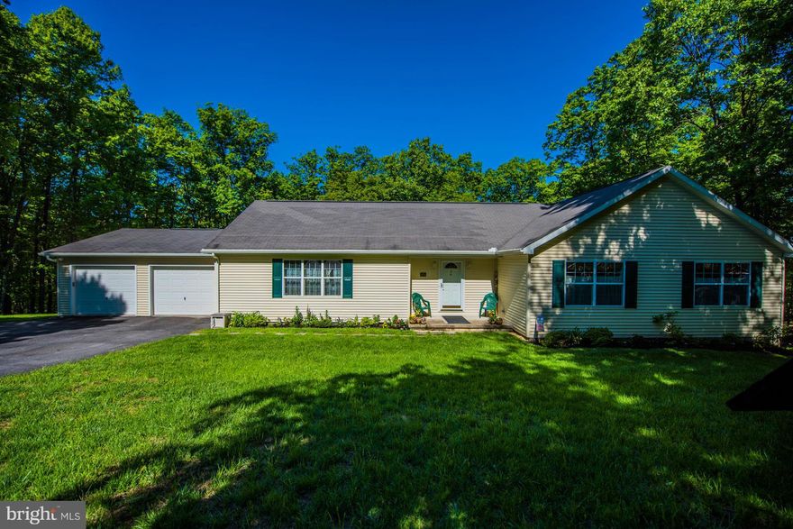 This house is bigger than it looks with over 3,000sqft of finished space. 4 bedrooms with possibility of 5th. Huge basement that is partially finished out with living room, bedroom, full bath and plumbing to add a kitchen in the additional 1200sqft that is unfinished. Main level has a large master with en suite. Nice wooded lot in a country setting less than 20 minutes from I-81.