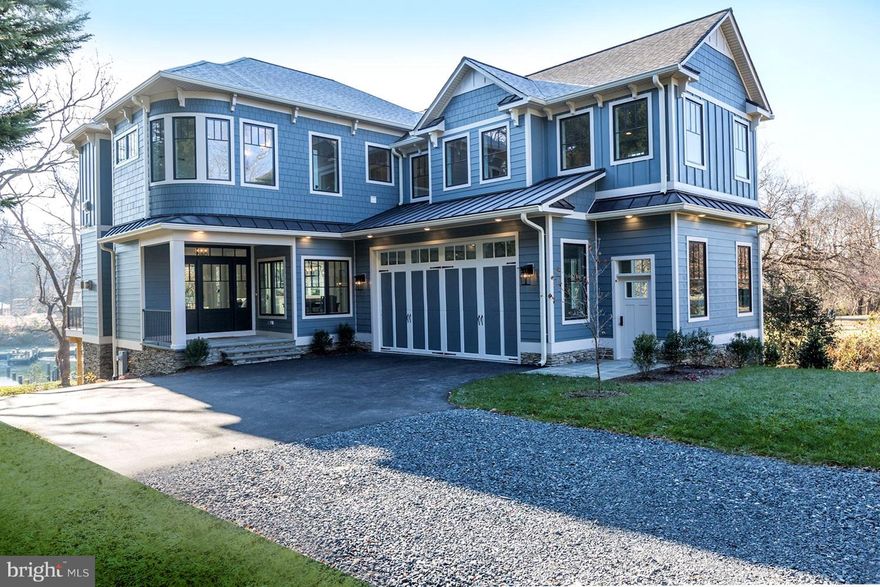 Meticulous attention to detail in this stunning CUSTOM built waterfront beauty.  From the moment you pull into the private drive, you will be in awe.  As you open the door, take a moment to take it all in....stunning views combined with an open floor plan accented with high end details.  10' coffered ceilings on the main level, 9' ceilings on the upper level, extended height doorways plus transoms - all designed to enhance the magnificent natural light.  Everywhere you turn, there is another detail to get excited about....entertaining kitchen that flows to the covered deck (skylights in the deck roof for natural light flow), custom tile kitchen backsplash, commercial grade appliances, quartz countertops. ELEVATOR to all floors leads you to the upstairs and a master bedroom that is to-die for.  Another tile surround fireplace, waterfront balcony, 2 rain shower spa like bathroom retreat, cavernous master closet.  Leave everyone else to fight over the other waterfront bedroom with en-suite bath as you enjoy your master haven.  Elevator back down to the full walkout basement rec room with full bath along with rear garage for all of your water toys!  Don't forget the main garage that has elevated ceilings and full windows for endless possibilities.  Too much to list it all......come see for yourself before it is gone!!!