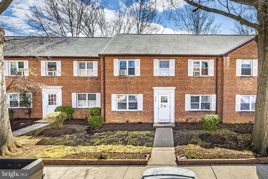 ALL UTILITIES INCLUDED in this RARE find -- TOWNHOUSE STYLE! 2-level  condo home, solid brick construction with private charming courtyard.. Only need to get WiFi/internet.  Real HARDWOODS THROUGHOUT & gorgeous tile in kitchen/baths. NO CARPET! ALSO -- ASSUMABLE VA loan is available if your VA buyer is eligible. Two bedrooms & 1 full bath up, and 1 half bath added to main level.  Lovely granite kitchen with 42" cabinets, stainless steel appliances (2018), breakfast bar, gas cooking, pretty glass tile backsplash with open concept ! Large primary bedroom on upper level  (with 2 closets) and bedroom #2 shares the beautifully renovated walk-in shower bath. Conveniently located full size laundry was added to upper level. The floored "easy access" attic storage is also a plus!  Generous-sized, private fenced patio offers dining, gardening, fire pit, grilling, relaxing & entertaining as you wish! Enjoy a quiet community that is pet-friendly (2 allowed, 50 pound max) with ample parking (2 parking space tags and 1 visitor tag.) An enclosed entry keeps deliveries secure and dry. Fantastic location, convenient to everything Arlington has to offer. Steps to neighborhood favorites such as Pupatella, Idido's Coffee and the weekly farmers market. Indoor and outdoor recreational options exist at nearby Walter Reed Recreation Center, pickleball & basketball courts and huge indoor facility. Easy access to Columbia Pike, Glebe Rd, Shirlington, Pentagon City, 395, and ART and WMATA bus lines to get you to downtown DC with ease. Charming 2 level living in the heart of Arlington !