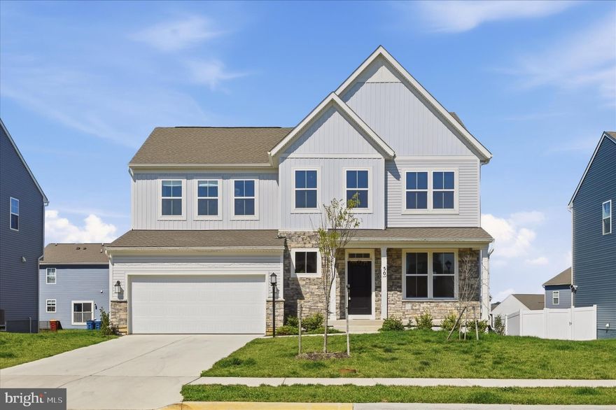 *Buyer financing fell through - don't miss this amazing opportunity to get a like-new home without the wait!* Built in 2024, this spacious new construction home in a fantastic, amenity-rich Charles Town community is loaded with builder upgrades and ready for immediate occupancy. The Norborne Glebe neighborhood features one of the only community pools in Jefferson County, along with playgrounds, tennis courts, and walking paths. It’s conveniently located off the main Rt.9/340 thoroughfare, providing easy access to local amenities, as well as Virginia and Maryland commuter routes. Special enhancements to this property include an inviting front porch, luxury vinyl plank flooring throughout the main level, 9-foot ceilings with recessed lighting, and a fully finished lower level. The open-concept main floor has a bright and airy feel. The focal point is a stunning gourmet kitchen with quartz countertops, a designer backsplash, a large island ideal for entertaining, high cabinetry, and a walk-in pantry. In additional to a large family room and dining area off the kitchen, there’s also a private office with French doors -- the perfect space for working from home, studying, or relaxing. The upper level offers four bedrooms and three full bathrooms, including a well-sized owner’s suite with a luxurious tiled shower and roomy walk-in closet. One of the secondary bedrooms is a princess suite with its own private en-suite bath. The other two bedrooms have walk-in closets, and the laundry facilities are conveniently located upstairs as well. The fully finished lower level provides additional living space with tall ceilings, a recreation area, and walk-out access to the backyard. The fifth bedroom and another full bathroom in the basement are ideal for guests or multigenerational living. Thoughtfully designed for today’s lifestyle, this beautiful home in a desirable community is ready for you!