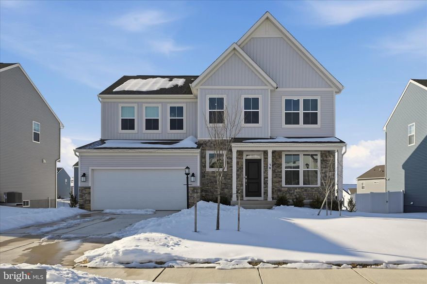 Like new without the wait! Built in 2024, this spacious new construction home in a fantastic, amenity-rich Charles Town community is loaded with builder upgrades and ready for immediate occupancy. The Norborne Glebe neighborhood features one of the only community pools in Jefferson County, along with playgrounds, tennis courts, and walking paths. It’s conveniently located off the main Rt.9/340 thoroughfare, providing easy access to local amenities, as well as Virginia and Maryland commuter routes. Special enhancements to this property include an inviting front porch, luxury vinyl plank flooring throughout the main level, 9-foot ceilings with recessed lighting, and a fully finished lower level. The open-concept main floor has a bright and airy feel. The focal point is a stunning gourmet kitchen with quartz countertops, a designer backsplash, a large island ideal for entertaining, high cabinetry, and a walk-in pantry. In additional to a large family room and dining area off the kitchen, there’s also a private office with French doors -- the perfect space for working from home, studying, or relaxing. The upper level offers four bedrooms and three full bathrooms, including a well-sized owner’s suite with a luxurious tiled shower and roomy walk-in closet. One of the secondary bedrooms is a princess suite with its own private en-suite bath. The other two bedrooms have walk-in closets, and the laundry facilities are conveniently located upstairs as well. The fully finished lower level provides additional living space with tall ceilings, a recreation area, and walk-out access to the backyard. The fifth bedroom and another full bathroom in the basement are ideal for guests or multigenerational living. Thoughtfully designed for today’s lifestyle, this beautiful home in a desirable community is ready for you!