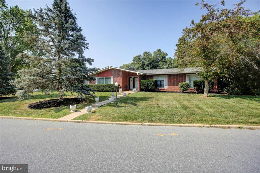 Keeping Up with the Market – New Price!

Welcome home to this solid all-brick rancher in the sought-after Spring Valley Wooded Estates. Offering 3 bedrooms, 2.5 baths, and a spacious layout, this home combines strong foundational integrity with updates already in place.

Enjoy a bright living room with a cozy wood-burning fireplace, a dining room that opens to a private patio, and a kitchen with stainless steel appliances, table space, and convenient laundry. The oversized sunroom and large family/den provide additional gathering areas filled with natural light.

The primary suite includes a full bath with bidet, and hardwood flooring lies beneath the carpet for those who love restoration potential. The unfinished basement offers endless options, plus a sump pump, dehumidifier, and whole-house water filter.

A two-car garage with attic access, extra refrigerator, and upright freezer add function, while major updates—including a brand-new roof, two-stage HVAC heat pump, upgraded outlets, and new smoke detectors—bring peace of mind.  Home warranty included for added peace of mind

With great bones and plenty of space inside and out, this home is ready for your personal touch. Schedule your private showing today!