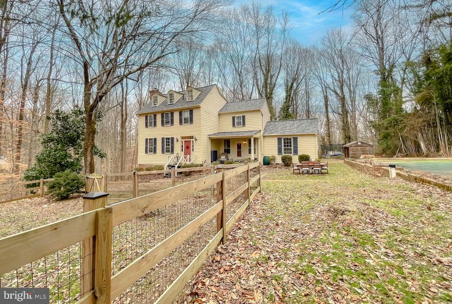 Get the best of both worlds in this federal era home with modern updates…NEW WELL & PUMP 2021! SOLD AS IS 
NEW ROOF 2023! NEW STEEL BEAM FOUNDATION SUPPORT 2023! NEW AC CONDENSER 2023! NEW FENCE 2021! Step into history with this beautifully preserved multilevel home, offering timeless character and modern comfort. Originally built circa 1793 in Lothian, MD, “Moreland Manor” is one of a handful of historic homes that were relocated to Huntingtown but Perry Van Vleck in the 1970’s. Nestled on 3.6 private acres backing up to serene woods, this 3-bedroom, 2.5-bathroom home is a perfect blend of rustic charm and elegant living. The formal entryway reveals wide-plank original hardwood floors and a classic staircase with open views to the top level. A massive living room is met with a stately fireplace and exposed hand-hewn original beams stretching across the high ceilings. The unique layout showcases the home’s original windows, hardwood floors, and hardware. The primary bedroom mirrors the living room with matching beams and fireplace. Two additional bedrooms provide great options for a guest room or home office. Outside, the large driveway is lined by dozens of azalea bushes and the house is bordered by blooms throughout the gardening season, including multiple varieties of hydrangea, peonies, and roses. Enjoy the tranquility of nature with mature trees and endless possibilities for entertaining, hunting, or simply unwinding in your own wooded sanctuary. Approximately one-acre fenced area is perfect for your pets, farm animals, or kids play area.