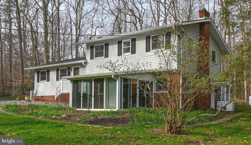 **OFFER DEADLINE 12pm 3/27**This home has three levels of finished space and is situated on one of the larger lots (.61 acres) in Loch Haven.    Inside offers 3 bedrooms plus an office/4th bedroom.   Recent renovations include refinished hardwood floors, kitchen appliances, newer carpeting on the lower level and fresh paint.   The living room/dining area on the main level is a large and open space with lots of windows to enjoy the views of the private wooded area behind the home.    Head downstairs to the waterproofed lower level to find the family room and the added sunroom gives the lower level even more space.    The upgraded kitchen offers ECO countertops and a reverse osmosis system.    Outside you will find a fully fenced yard with 3 storage sheds.   The property has excellent drainage and beautiful trees, including Maple, Red Bud, Cherry Blossom and American Beech.    The Viburnum bush, Butterfly bush, Mock Orange bush, Day Lillies, lavender Resurrection Lillies, and Ruffled Lillies will be blooming soon.     There is a whole house generator, RV or boat parking with 30 and 50 amp outlets.    The A/C was replaced in 2019.    Take a walk, ride your bike or jump in your golf cart and head over to the sought after Loch Haven amenities, including the beach with netted swim area, marina and boat ramp, kayak storage, playground, tennis/pickle ball court, basketball court, volleyball court and the overlook for some beautiful sunrises.    Excellent location for commuting to Baltimore, DC or Ft Meade.   Easy access to restaurants, shopping and medical facilities.   South River Blue Ribbon Schools.