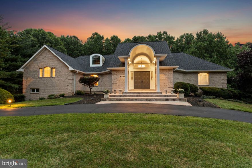 Offers, if any, due on Tuesday, Aug. 6th at 7pm.  

Situated in the desirable Woodfield Estates Community, a custom home community, this all-brick home was custom-designed by an architect who appreciates indoor-outdoor living and natural beauty. This blend truly sets this custom home apart, making it one of a kind and a rare find. The expansive 1.78-acre lot nestled in a private cul-de-sac and backing onto protected Parkland ensures tranquility and privacy, making it an ideal retreat for nature enthusiasts.

Upon entering, the grandeur of the two-story views captivates your attention to the picturesque grounds and a striking dual-sided staircase leading to the family room. The family room itself is a centerpiece adorned with atrium window details and French doors that open to the covered patio, pool, and sun deck, enhancing the allure of indoor-outdoor living.

The home boasts a thoughtfully designed layout with 5 bedrooms and 4 bathrooms spread across its 5,000 square feet of living space. The main level includes a library or study, a spacious kitchen with custom white cabinetry, stainless steel appliances, and quartz countertops, and a sizable island ideal for casual dining with views of the pool and herb garden.

Upstairs, the bedroom wing offers a private sanctuary for both families and/or guests and a distinct primary suite. The guest wing features 3 bedrooms and 2 bathrooms, each generously appointed with ample storage and access to balconies showcasing pool views and lush surroundings. The primary suite exudes luxury with vaulted ceilings, a custom-organized walk-in closet, and a renovated ensuite bath boasting double vanities, a soaking tub, and a glass and tile shower. A private balcony and spiral stairs leading to the pool further enhance the suite's exclusivity.

For additional versatility, the home includes a third level with office space and a dedicated home theater catering to various lifestyle needs.  Overall, this residence epitomizes comfort, elegance, and the allure of serene natural surroundings, making it a coveted haven in the Woodfield Estates Community.

Please note: This property is being monitored by surveillance equipment.