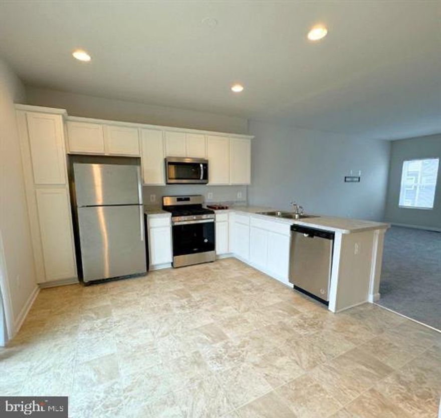 Beautiful "like new" built in 2024 townhome in Snowden Bridge. Has only been lived in since this past December. Great opportunity without the wait of new construction. This spacious 3 level townhome has much to offer. 3 spacious bedrooms, 2 full baths, 2 half baths. Filled with plenty of natural light on every level. 
Beautiful spacious kitchen with white cabinetry with plenty of dining space. Sliding glass doors of kitchen lead out onto the deck for a peaceful spot to enjoy a meal or your morning coffee.