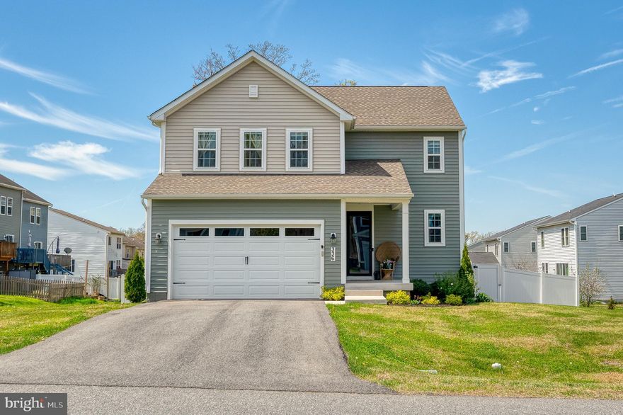 Better than new: Built in 2022, this upgraded home is packed with features that truly stand out. From the moment you arrive, you’ll notice the inviting covered front porch, two-car garage, and a level backyard complete with a maintenance-free deck and privacy fence backing to trees. Inside, luxury vinyl plank flooring flows throughout the main living areas. The kitchen has stainless steel appliances, quartz countertops, a breakfast bar/island, under-cabinet lighting, stylish backsplash, hood vent, and a charming barn door accent for the pantry. Custom shelving adds both function and personality. The recently finished lower level offers a spacious family room, recessed lighting, and a rough-in for a future bathroom. Upstairs, you’ll find a versatile loft, convenient upper-level laundry, and a spacious primary suite featuring a walk-in closet, custom blackout shades, and a beautifully tiled en-suite bath. Two additional bedrooms include carpet, ceiling fans, and ample space, along with a full hall bathroom. Located near the headwaters of the Chesapeake Bay, this community offers easy access to outdoor recreation including walking trails, open spaces, golf courses, downtown North East and Elk Neck State Forest. Commuting is a breeze with quick access to I-95 and proximity to Wilmington, Philadelphia, and Baltimore. SEE UPGRADE LIST.