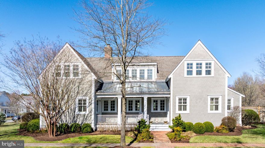 Combining timeless coastal charm with modern upgrades, this exceptional property in Cooke’s Hope offers a rare opportunity to enjoy elegant waterfront-inspired living in a picturesque setting. Designed by renowned architect Lyman Perry and built by Ilex Construction, this meticulously maintained coastal-style home in the desirable Cooke’s Hope community offers an exceptional blend of craftsmanship, elegance, and modern convenience. Situated on a large half-acre+/- corner lot with serene views, this residence boasts 5 bedrooms, 3.5 bathrooms, and a detached 2-car garage with a studio above. The thoughtfully designed floor plan features a desirable main-level primary suite, ideally curated living spaces, and a versatile fifth bedroom or private office with exterior access. A bonus room with skylights provides additional flexible living space, perfect for a studio or office. Throughout the home, custom shutters, 8-foot solid cherry pocket doors, and a floating cherry bookcase with a fireplace enhance its character and warmth. The gourmet kitchen is equipped with custom solid wood cabinetry, Monogram & KitchenAid stainless steel appliances, a French door double oven, high-velocity range hood with a remote motor, and a 56-bottle wine fridge. Custom tile baths and high-end finishes throughout the home reflect meticulous attention to detail. Outdoor spaces are equally impressive, featuring a custom pergola, lush landscaping, fully irrigated yards, and ample room for a pool. The top-of-the-line NuCedar siding ensures a maintenance-free exterior, while Benjamin Moore Aura exterior paint covers all trim. This coastal retreat is designed for both luxury and efficiency, with a sealed crawl space, Aprilaire whole-home air and humidity control systems, and extensive underground drainage.