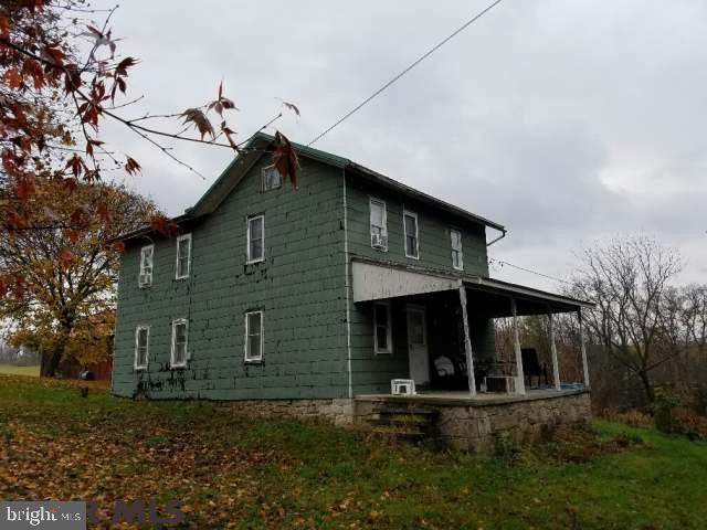 Always wanted that mini-farmette?? This is the place! 2 story farmhouse is in need of some work but it has good bones! There's a Summer Kitchen- currently used for storage, Well House, Small barn and Very Large Barn all included! Newer roof on house, summer kitchen, well house and front & left side of large barn. With 3.22 acres, you can spread out or just relax in peace! Acreage partly wooded also! If you're looking for that fixer-upper project for the winter, this is the one you should check out! Square footage provided by county records, buyer to confirm! No farm animals allowed according to township.