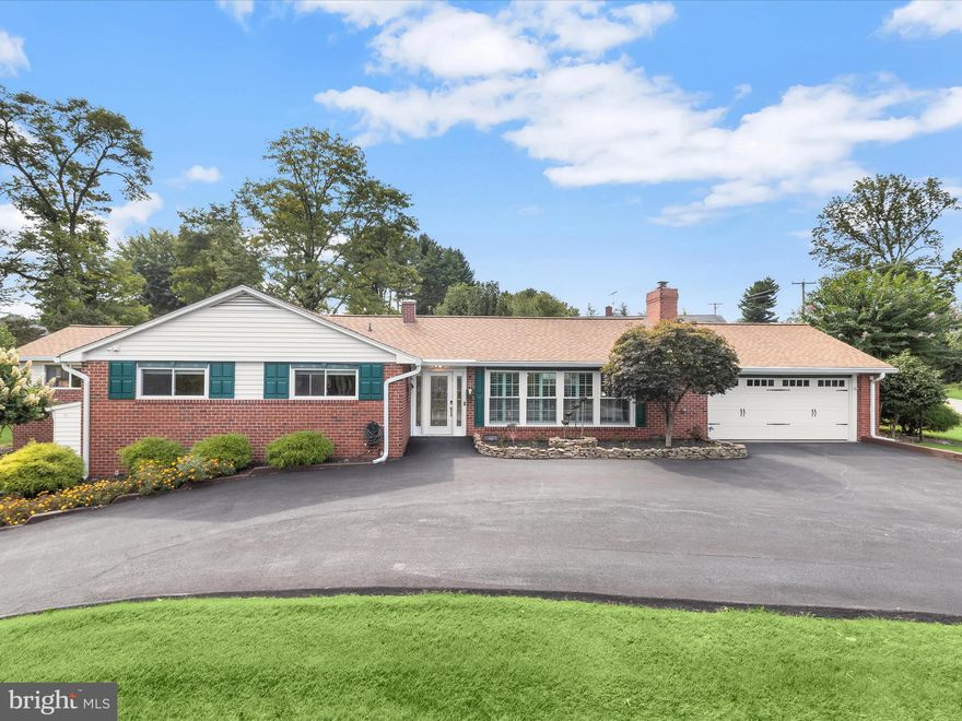 Introducing this three bedroom, two and a half bathroom home set on a 0.47-acre corner lot in the coveted Stevenson community. Graced by beautiful landscaping, this home offers a peaceful setting while still being minutes from shopping, dining, and major commuter routes. Generous side and backyards provide plenty of outdoor space for gardening, entertaining, or play, giving the home a sense of openness and versatility. Step inside to a welcoming foyer that leads into the spacious living room, where a cathedral ceiling, custom plantation shutters, hardwood floors, and a cozy gas fireplace create a warm and inviting atmosphere. The kitchen is appointed with stainless steel appliances, gas cooking, granite counters, and a decorative tile backsplash, blending both function and style. Just steps away, the dining room is enhanced with elegant crown molding and opens through a glass door to the deck and backyard, creating an easy connection for indoor and outdoor living. The primary bedroom suite has been expanded to create a spacious retreat. The addition features a sitting room, while the bedroom boasts a soaring cathedral ceiling, two closets, built-ins, and a dedicated mini-split system for comfort throughout the year. Completing the suite is a luxurious bathroom featuring a walk-in steam shower with bench seating and dual shower heads. Rounding out the main level are two additional bedrooms with a connecting French door and a second full bathroom with a tub shower.  Downstairs, the lower level extends the home’s living space with a versatile recreation room and half bathroom, perfect for hobbies, gatherings, or casual lounging. A spacious laundry room with walk-out access to the yard, along with a utility room and separate storage room, adds convenience. Outdoor living is equally enjoyable with a private fenced area that includes a deck and a tranquil pond that enhances the setting. Additional open yard space offers room to spread out, and a storage shed is ideal for tools and outdoor essentials. A circular driveway and two-car garage provide plenty of parking.