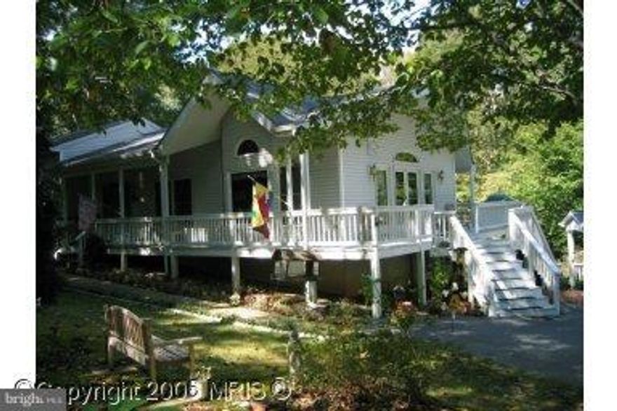 Beautiful open floor plan split level in downtown Hollywood! 3 car detached garage, with lots of paved parking. Full finished walk out basement with fireplace with a woodstove insert. Main level has a pellet stove, separate dining and family room. Deck, fenced yard and all on over 2 acres.   Shows like a model.