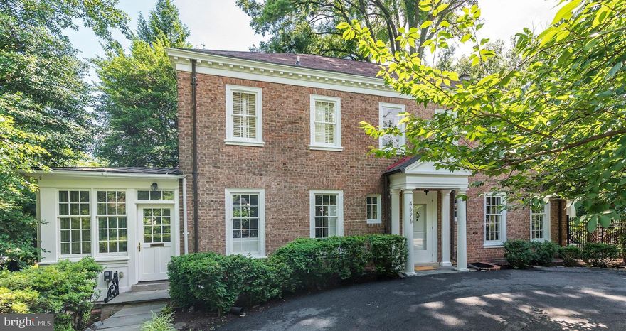 Just renovated and refreshed, this gracious Georgian property is simply beautiful, and offers unprecedented space and privacy for its urban location. The unique home offers soaring ceilings, exquisite millwork and built-ins, in an open 4200+ square foot floor plan with large gracious formal and casual rooms. Sited on a private 14,000 square foot lot, the light-filled house connects with porches, a large terrace, and rear and side gardens through multiple French doors. The spacious sparkling white Gourmet kitchen with large center isle, is open to the grand Dining Room.  A cozy Breakfast/Family Room off the Kitchen is lined with windows. The main level includes a gracious entry Foyer, a Office with built-in bookshelves and a Powder Room. A lovely curved staircase leads to the upper level with 3 generous Bedrooms, each with it own full ensuite Bath. The wonderfully large Owners Bedroom Suite has its own balcony and an exceptionally pretty Owners Bathroom. The home's finished lower level offers a large Family Room with fireplace, a fourth Bedroom with ensuite full Bath, generous laundry, storage and work spaces, and garage access. A long driveway leads past the 2-car garage to a circular drive at the front of the home,  providing a beautiful entrance to the home and grounds. Gardens surrounding the house abound in specimen plantings and lovely blooms throughout the year, and the grounds can easily accommodate a pool and pool house.  Minutes from Georgetown and Foxhall, in the great Berkley neighborhood, the house enjoys a great location, close to everything, with easy access to downtown DC and Virginia, with the city's best public and private schools within easy distance. The current owner has invested heavily in updating and restoring the property, making it a delight to see. The home is presented in move-in condition. Don't miss this one-of-a-kind property and offering!