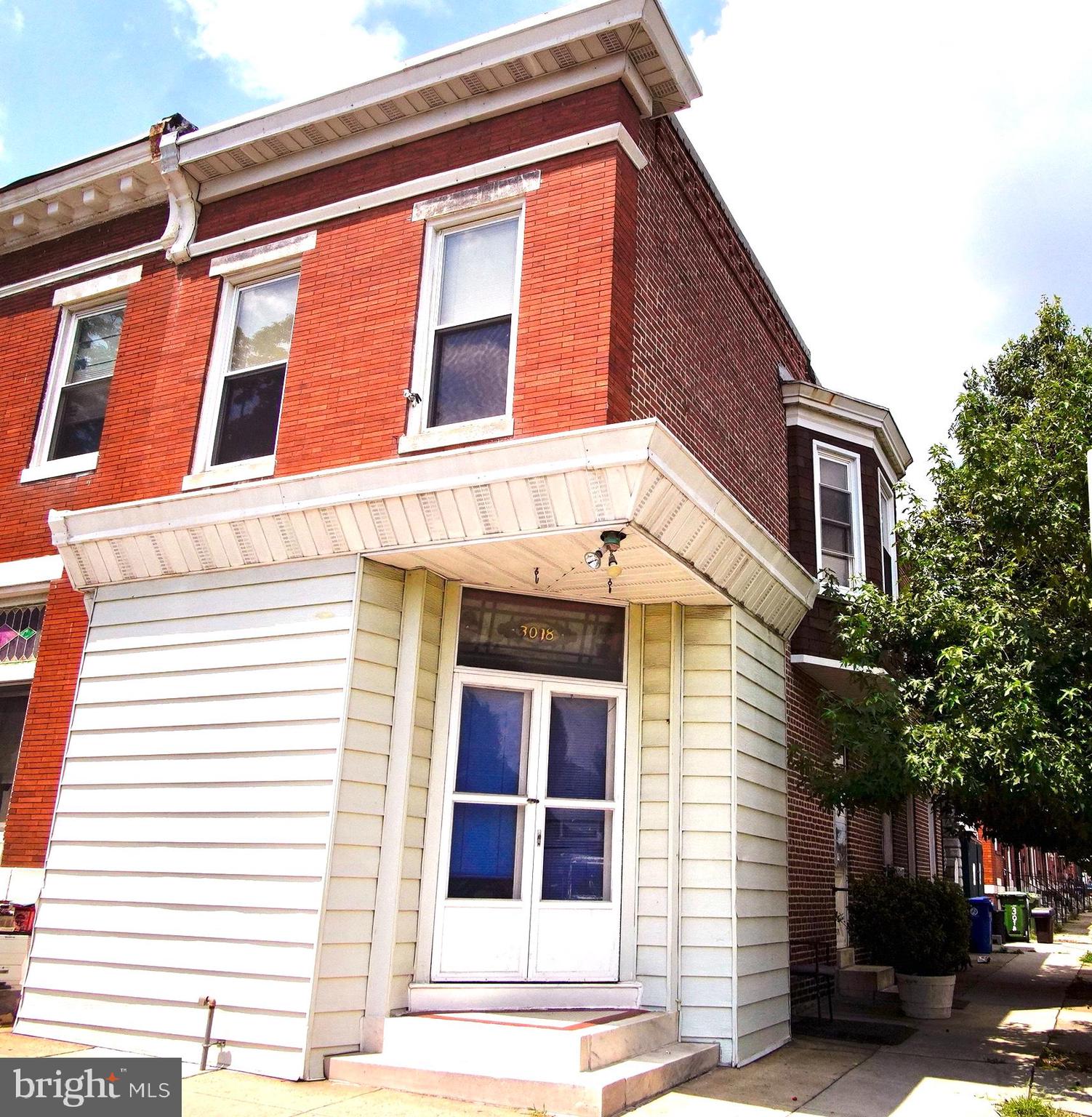 Historic, affordable end of group rowhome with 12+ foot ceilings and beautiful original details, including stained glass transoms, wood floors, and mostly unpainted wood trim and moldings. The home also has a courtyard and a detached garage. The main level has large rooms and opens to a storefront office space. Large eat-in kitchen with vintage gas range. The upper level has a skylight, 3 spacious bedrooms, and one full bath. The front bedroom has a fireplace. The middle bedroom has a lovely bay window and the rear bedroom has a balcony off of the bedroom. The home has been well maintained. The garage is easy to access as an end of group. The basement has good ceiling height, a functioning toilet and washer and dryer-- the space is presently unfinished. This is an estate sale and the home is sold "as is".