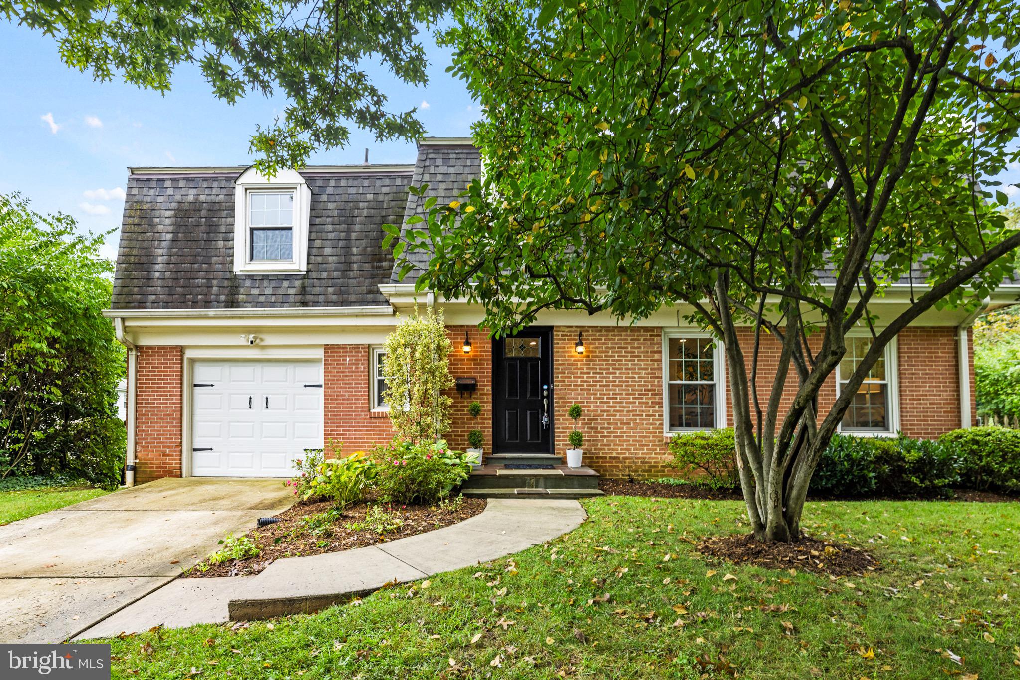 Stunning Dutch Colonial, boasting 4 bedrooms, 3.5 bathrooms, PLUS an office AND a den on 3 finished levels with nearly 4,000 SF of living space! Situated on a large, gorgeous, private, fenced corner lot in Maplewood Manor, this home offers a dramatic open floor plan thanks to a large addition. The family/living room showcases stunning cathedral ceilings and hardwood floors. Inviting living room off the kitchen features a wood burning fireplace & cozy lighting, perfect for relaxing after dinner or hosting company. Indoor - outdoor flow lives like a dream at this home with 3 large sliding doors providing access to a magical yard. Just off the dining room, a large wrap around terrace overlooks the beautifully landscaped and fenced back and side yards with an inviting garden, brick patio, and extensive greenery—perfect for relaxing or entertaining. You'll even find a kitchen herb garden right outside the kitchen door! Upstairs you'll find a TRUE 4 bedroom plus a BONUS office/den/nursery space. The spacious primary bedroom includes a HUGE walk-in closet and spa-like en-suite bath with a dual vanity and shower. The three secondary bedrooms are generously sized with ample closet space and share a large hall bath with a deep soaking tub and designer tile. The newly renovated lower level features a large rec room, another den, a full bath, and a laundry room with a utility sink. A 1-car garage offers extra storage, and the driveway provides parking for two additional cars! Location is unbeatable: 2 blocks to Maple View - Alta Vista Park, minutes to Bethesda and Chevy Chase for premium shopping and dining, and just a bit further to the Strathmore Music Center for great entertainment. Close to NIH, Suburban Hospital, Walter Reed, The French School, and more! Commuter-friendly with easy access to 495 and other major routes, plus just 1.5 miles to the Medical Center Metro and a block from the bus stop. Located in the Wyngate / North Bethesda / Walter Johnson school district. A perfect combination of space, location, and convenience—Welcome Home!