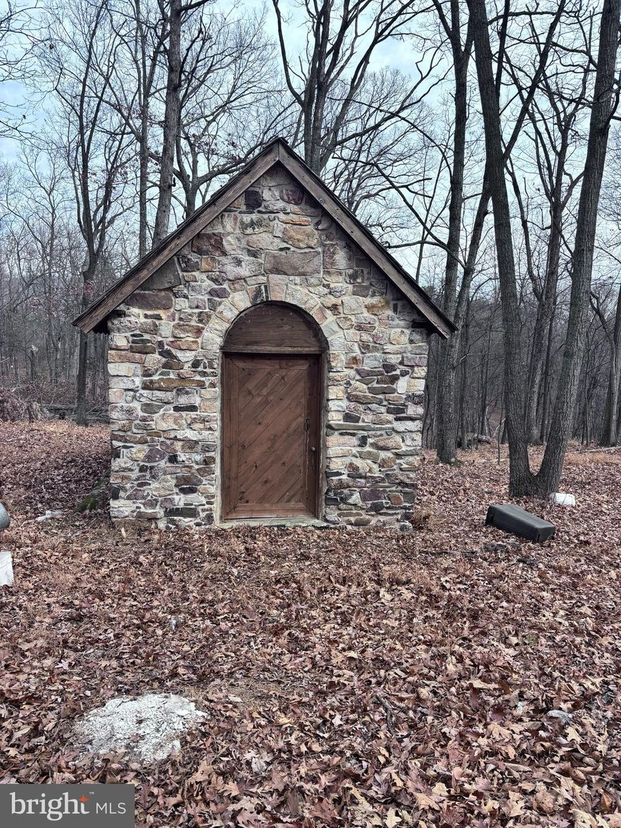 5 acres with a hand-built stone cabin located just 30 minutes from downtown Winchester. See attached deed and plat.