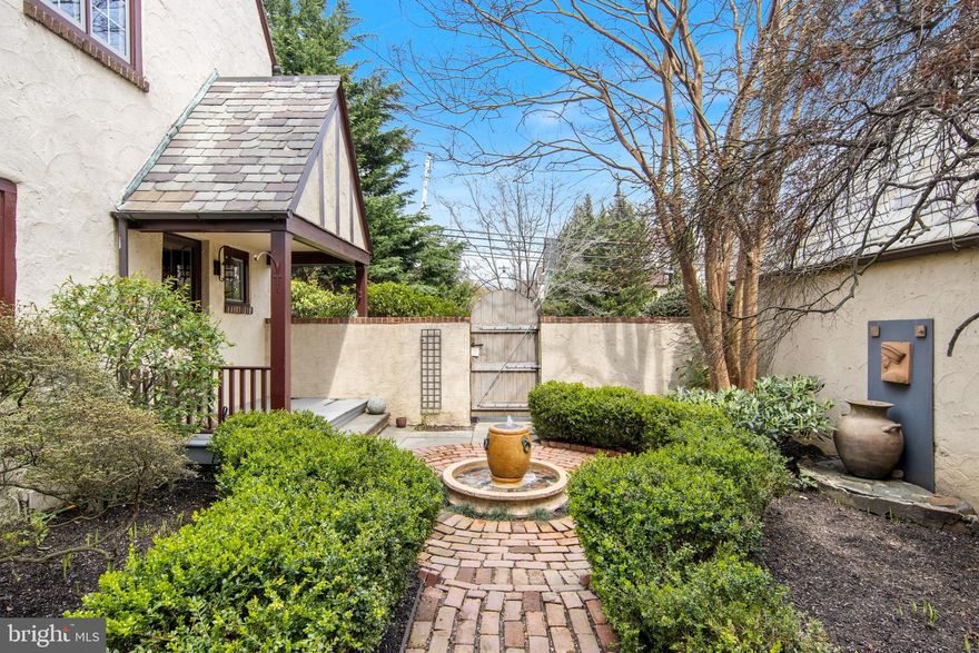 OPEN HOUSE SATURDAY APRIL 20th 2-5PM. Welcome to this charming Tudor in Downtown Wayne with an outdoors lover's dream! This pristine home showcases original craftsmanship while highlighting modern flair.  Enter the European walled sanctuary through an engaging gate to be welcomed by the incredibly private, picturesque grounds including a large bluestone patio spanning the width of the home, providing ample space for outdoor dining, and access to a copper-roofed potting shed. As you continue through the enchanting pathway showcasing the professionally landscaped gardens and leading to the stunning in-ground pool all illuminated by a new in ground lighting system - you'll spend countless hours in this private oasis. Situated on a corner lot allows for two separate driveways - one complete with a two car detached garage- there is plenty of parking for all. 
The home greets you with the center foyer, where you are welcomed by original hardwood floors and crown molding that continue throughout much of the home. The ground floor consists of the formal living room (complete with access to the private screened porch), large dining room, gourmet kitchen, cozy den, and powder room.  
The gourmet granite kitchen showcases appliances fit for a cordon bleu chef - stainless steel Bertazzoni range and oven, Mielle microwave/convection oven with warming drawer and built in Mielle espresso/coffee maker.  The eat-in breakfast nook comes with a fitted banquette which creates the perfect space to enjoy your morning coffee. 
The large dining room, with stunning garden views from two walls of windows, provides ample space to accommodate many dinner guests or host an intimate meal.
The formal living room showcases the proud craftsmanship which is timeless, yet very difficult to replicate today. Such as the ceiling beams, fireplace, built in bookcases and French glass doors leading to the private bricked screened-in porch. The location of this sitting room allows for the second set of French doors to be closed for solitude or quiet from the rest of the home.
The cozy den is the perfect place to relax and decompress. This would also make an excellent home office. The custom plantation shutters allow for the perfect light- whether for work or enjoying the TV.
Heading up the staircase following the new custom stair runner, framed by the crafted banister you will find on the second floor - the main bedroom with ensuite bath, two additional substantial bedrooms and a hall full bath.
The spacious main bedroom has a unique wall of closets with a hidden cedar closet behind, ceiling fan and gorgeous views from the many windows. The ensuite bathroom is state-of-the-art with a steam shower, double sink vanity and Toto washlet toilet. 
Continuing up the stairs to the third floor you will find the fourth bedroom and third full bathroom. This useful space can be used as a guest suite or an additional family room. There is also additional attic storage.
The full basement of this residence also offers much more storage, laundry facilities and even a climate-controlled wine cellar!
Walk to Wayne to enjoy the local shops and restaurants, as well as the convenience of the train station to access the City in minutes. In addition, proximity to many major highways, King of Prussia Mall and the local award winning Radnor Township Schools make this home unbeatable!