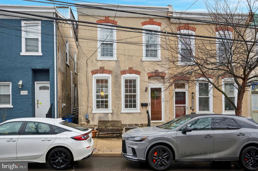 Nestled on a quiet street in Philadelphia’s vibrant East Falls neighborhood, this 3-bedroom, 2.5-bathroom gem seamlessly blends contemporary style with classic charm just minutes from center city! As you enter, you’re greeted by a light-filled living room, sleek hardwood floors, and a warm, welcoming ambiance that leads to the formal dining room through the original French doors. Beyond you will find the eat-in kitchen, full bathroom, and exit to your private backyard oasis, with covered seating area and large outdoor patio. Upstairs there is another full bathroom, a hall closet, and 3 good sized bedrooms. The basement has high ceilings perfect for finishing as another living space with lots of storage room and a half bathroom. As an end row home you have easy trash removal through the side alley. Free 12 car parking lot on the street. The elementary school is the sought after Thomas Mifflin School and you’re just steps away from the iconic Schuylkill River Trail for biking or jogging, beautiful McMichael Park, as well as the charming cafes, restaurants, and shops on Midvale and Ridge Aves that make East Falls such a sought-after community. Plus, with easy access to Manayunk and Center City via nearby SEPTA rail lines, buses, and major highways, this location truly offers the best of both worlds. (New roof 2025, central air)