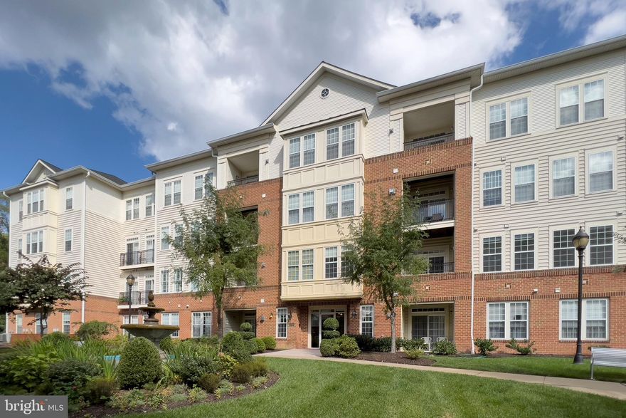 This classy 3 bedroom 2 bath 55+ condo unit in desired Enclave at Ellicott Hills is situated on the 2nd level of an elevator building & overlooks the stunning courtyard complete with attractive landscaping & fountain! This turn key unit was just freshly painted + brand new carpeting just installed; new heating and cooling system in 2022 & the roof was just replaced in 2023! This expansive unit has it all - a separate dining room; a great kitchen with generous cabinet space with adjoining breakfast room / den; living room with custom built ins; convenient in unit laundry room; primary bedroom suite with TWO walk in closets + two additional bedrooms & a bath. Enjoy your very own coveted in building, extra large garage & a separate storage room too - and they are right next to each other!! An active & vibrant lifestyle awaits in this community including: outdoor pool, tennis, clubhouse with gym / game & meeting rooms, social activities & more.