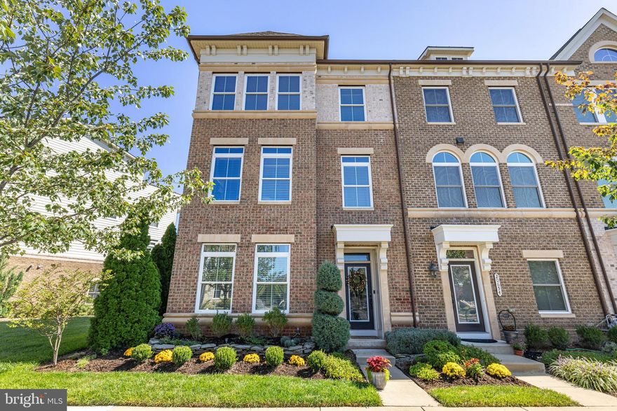 Welcome to a home that redefines modern luxury, blending elegance, comfort, and unparalleled convenience in the heart of One Loudoun. This 4-bedroom, 4.5-bathroom end-unit townhome is more than just a residence—it’s a statement of style, a sanctuary of space, and a gateway to an extraordinary lifestyle. From the moment you arrive, the classic brick exterior and stately end-unit positioning create an aura of distinction. Step inside and feel the warm embrace of natural light as it floods the bright, open entryway. On the walk-out lower level, you’ll find a private in-law suite—a spacious bedroom and a full bath, making it the ideal retreat for guests, extended stays, or a dedicated home office. The 2-car garage is equally impressive, featuring a freshly painted, epoxy-finished floor and walls, offering a pristine, polished look that is both stylish and durable. As you ascend to the main level, you’ll discover a kitchen that is nothing short of breathtaking—a chef’s dream, completely remodeled with custom, high-end finishes. The brand-new cabinetry extends to the ceiling, adorned with decorative molding, soft-close hinges, and pull-out organizers—all designed with both beauty and function in mind. The oversized island offers ample prep and seating space, while the farmhouse sink and custom backsplash elevate the aesthetic. Cooking is effortless with a NEW GE “Profile” 36-inch Tri-Ring Gas Cooktop, featuring five burners and an extra-large integrated griddle. The NEW Bosch 800 Series Dishwasher ensures your kitchen stays as quiet as it is stunning. Throughout the home, beautiful mocha hardwood floors create a seamless, polished feel while offering durability and timeless appeal. The open-concept living and dining areas invite you to relax, entertain, and connect. Oversized windows bathe the space in natural light, while a private balcony off the kitchen provides the perfect spot to sip morning coffee or unwind as the sun sets. For added convenience, a stylish half bath ensures guests feel right at home. When it’s time to retreat, the spacious primary suite awaits—an oasis of calm and sophistication. The his and her walk-in closets offers plenty of storage, while the luxurious en-suite bath features dual vanities, a soaking tub, and a glass-enclosed shower—a spa-like escape where you can unwind after a long day. Two additional bedrooms provide private, sunlit sanctuaries. A convenient laundry room is located on the bedroom level. The top-level loft presents endless possibilities. Whether you envision it as a home office, media room, fitness studio, or creative retreat, this space is ready to adapt to your lifestyle. Step outside to the private rooftop terrace, breathe in the fresh air, enjoy a quiet morning with a book, or host unforgettable gatherings under the stars. With professionally landscaped surroundings and meticulous maintenance, including annual HVAC tune-ups, monthly pest control, and exterior upkeep, this home is not just move-in ready—it’s ready to impress. Living in One Loudoun means having everything you need at your fingertips. The community amenities are second to none, offering a pool, community center, walking trails, soccer field, volleyball sand court, tennis courts, dog parks, tot lots, an indoor basketball court, and even a central park. When it’s time to explore, Downtown One Loudoun is just a stroll away, featuring Trader Joe’s, boutiques, top-rated restaurants, a Saturday farmers market, a movie theater, and more. The Metro is just 10 minutes away, Wegmans and Harris Teeter as around the corner, and major destinations like Top Golf, the Washington & Old Dominion Trail, Whole Foods, Costco, Target, and the Leesburg Outlets are all nearby. This isn’t just a house—it’s a dream home in a dream location. A place where elegance meets everyday comfort, where entertaining is effortless, and where every detail has been designed with you in mind.