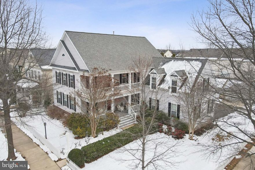 Step into this award-winning Williamsburg design and experience a home perfectly crafted for modern living. Boasting 4,400 finished square feet, this spacious home offers 5 bedrooms, 3.5 bathrooms, and an array of thoughtful features designed to fit your lifestyle. The charming exterior has two covered front porches, a classic white picket fence surrounding the fully fenced yard, and a convenient side-entry 2-car garage. The expansive living spaces on this home offers an open floor plan includes separate dining and living rooms, perfect for formal gatherings or cozy evenings at home. A home office provides a private and quiet space for work or study. The spacious kitchen features wall ovens, a cooktop, ample cabinets, abundant counter space, and a pantry, all with easy access to the deck for outdoor dining and entertaining. Gather in the large family room off the kitchen, complete with a gas fireplace and a private staircase leading to a bonus retreat room off the owner’s suite. The primary bedroom includes a step-down retreat area, spa-like bathroom with dual vanities, a soaking tub, separate shower, and generous walk-in closets. The versatile lower level includes a recreation room currently used as a home theater which all theater equipment conveys, a 5th bedroom or den, a full bathroom, and convenient walk-up stairs to the backyard. The irrigation system makes for easier lawn maintenance and the pull down attic steps lead to additional storage space which include shelves! This exceptional property combines timeless elegance with modern amenities, creating a home that is as functional as it is beautiful. Don't miss the opportunity to make this dream home yours!  

Discover the perfect blend of timeless charm and modern convenience in Belmont Greene, a neighborhood that offers the character of a bygone era alongside all the amenities you need for today’s lifestyle. Ideally situated, this community is close to shops, restaurants, entertainment, fitness centers, golf courses, wineries, and breweries, making it a hub for leisure and recreation. Just a short drive away, the Town of Leesburg provides the quaint appeal of a historic small town, while Washington D.C. offers world-class dining, shopping, museums, theaters, and countless cultural experiences. With convenient access to main roads, commuting to Chantilly and D.C. is seamless, and for those who travel frequently, Dulles International and Reagan National Airports are just a quick trip away. Belmont Greene isn’t just a neighborhood—it’s a place to experience the best of both worlds.