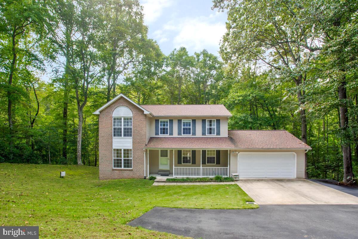 Nestled in the serene backdrop of nature's wonderland in Dunkirk, MD, this exquisite 4-bedroom, 3.5-bathroom residence at 9710 Tara Drive boasts a generous 3330 sq. ft. of living space. The property offers an oasis of privacy, as it is bordered by lush trees ensuring tranquility away from the bustle of Route 4. Recently updated with a new roof in September 2021, a fresh well pump in September 2022, and an upgraded heat pump as of November 2023, this home promises modern comforts wrapped in peace of mind. The vast back deck invites endless entertainment possibilities, while the 2-car garage and paved driveway cater to your automotive needs. An extensive drainage system directs water run-off to the back ravines. Central air conditioning ensures year-round comfort. Located conveniently close to local shopping and restaurants, this home is an exceptional find for those seeking convenience without compromising on privacy.