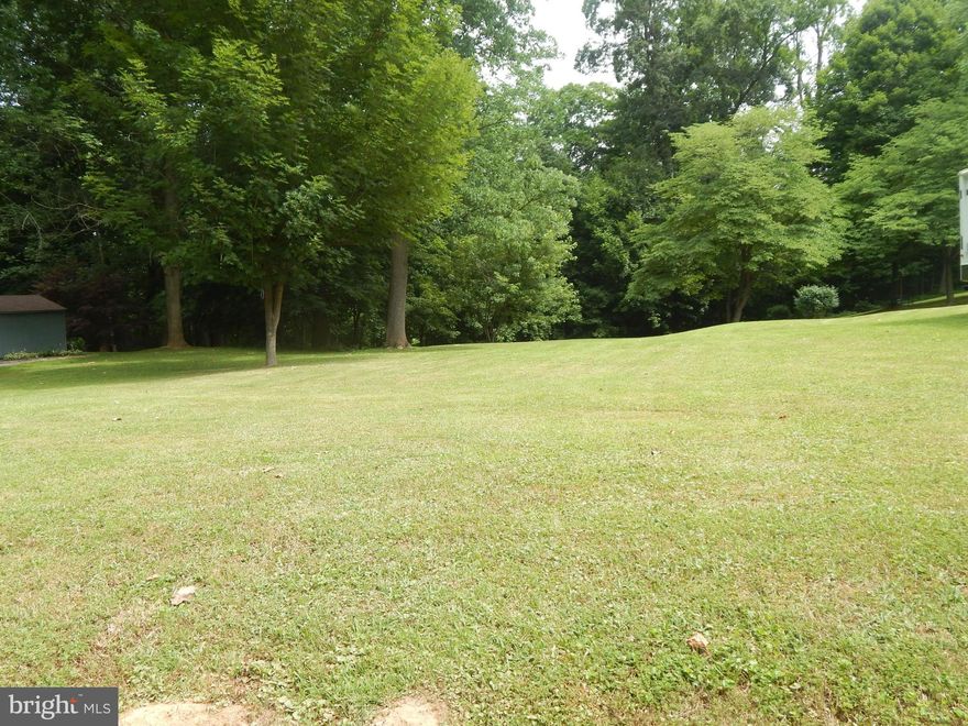 Waterfront Lot on the Potomac River as well as community access.  1.08 Acre lot lays level at the road, but waterfront access is steep.  Fronts county maintained road.  Perfect for weekend or full time living.  Seller will provide a perc.