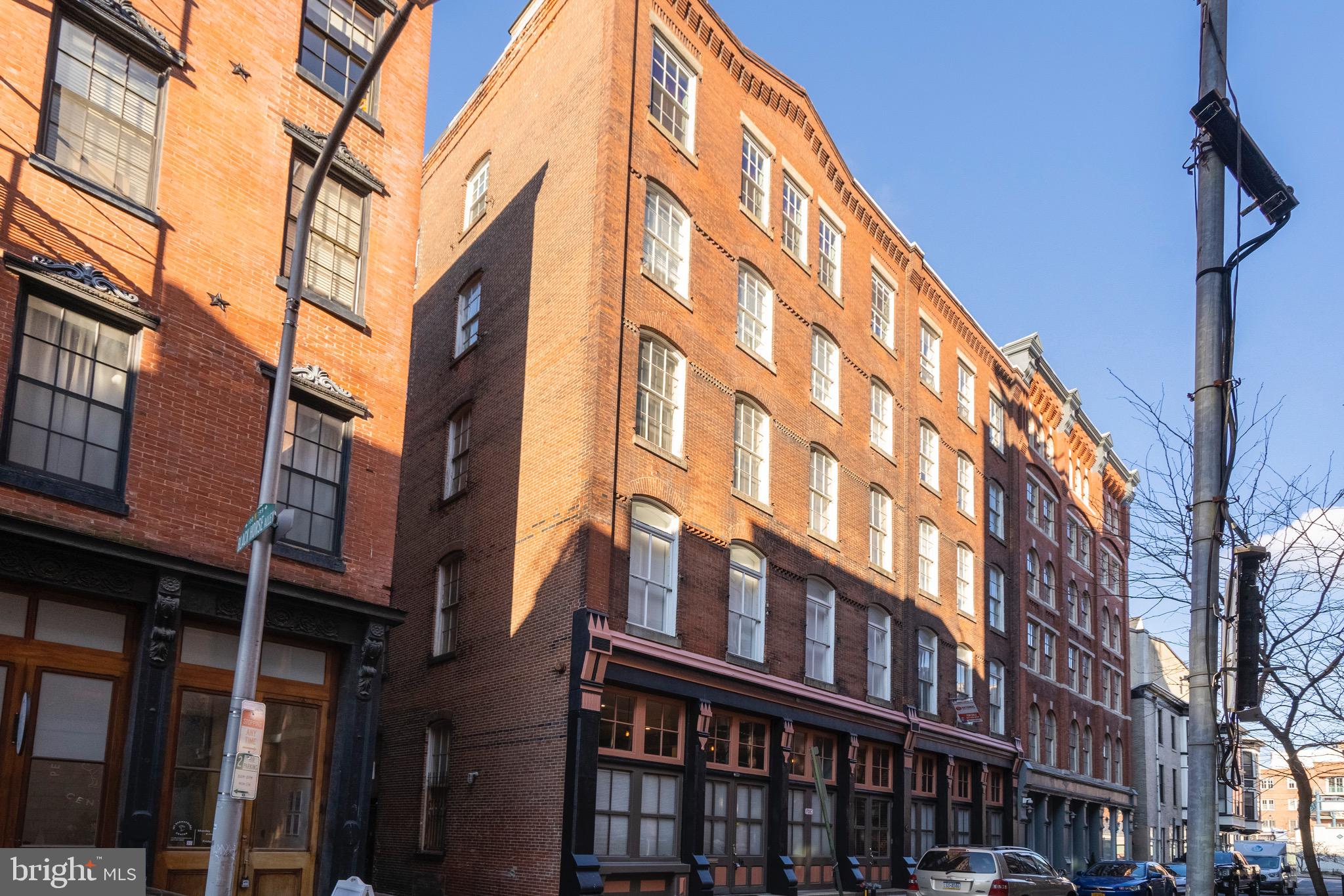Black Horse Alley is a boutique condominium community of only twenty-five uniquely appointed units. This residential conversion of a historic building is nestled on a quiet side-street just off the hustle and bustle of Old City’s Penn’s Landing and Market Streets. Just steps from cafes, coffee shops, renown restaurants, art galleries, boutiques and museums. Conveniently located close to public transit with easy access to I-95, Ben Franklin Bridge & Philadelphia Airport. The modern, secure lobby provides elevator access directly to the roof deck. Unit 103, a ground floor loft, boast exceptionally high ceilings and oversized windows inviting natural light. Original architectural details pair beautifully with top-of-the-line stainless steel appliances, granite countertops and hardwood floors. All units have access to the common roof deck allowing residents and guest exception views of historic Old City and the Philly skyline.