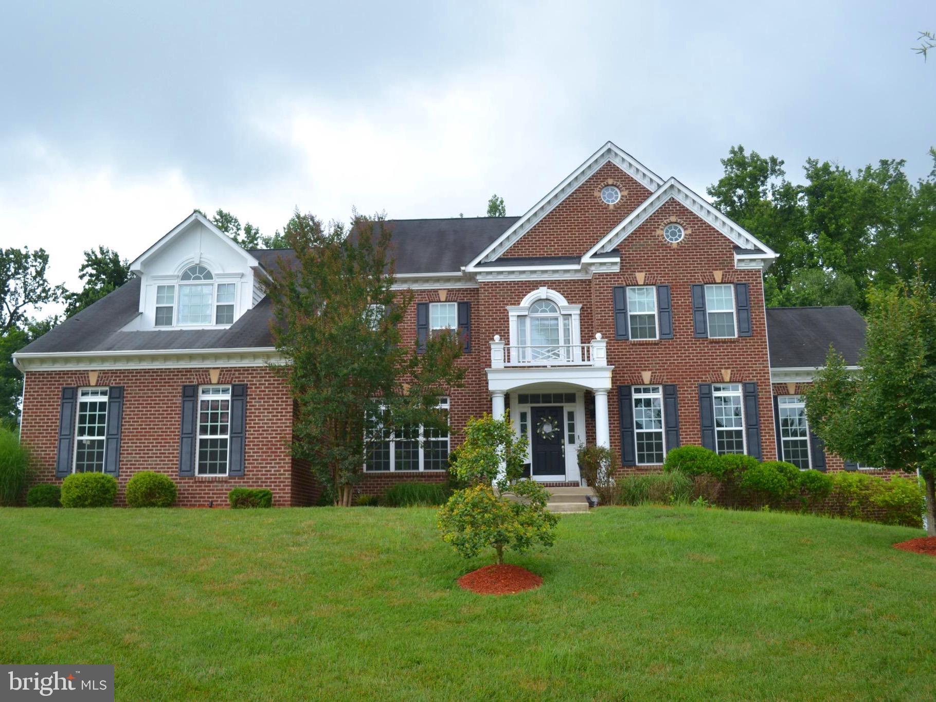 **Newly available home in one of the best locations in Prince George’s County.** This home has been model home maintained and now ready for you to make it your Own. The moment you arrive to this tucked away gem, you are greeted by a pleasant landscape. Pulling into the driveway, choose one of three garages to store your vehicle. Step into this home and arrive in the foyer perfect for greeting guest. Move the conversation into the living room and feel the sense of luxury as you walk across the porcelain tiled floors. These floors are also installed in the dinning room for a sense of balanced luxury. Explore the main level and imagine using the Sun Room, Office, Great Room, or Morning/Breakfast Room to relax or entertain guest. The Gourmet Kitchen is designed to enjoy cooking and conversation, with its open concept. The main level also has two separate stair cases to access the second floor. No need to take laundry to the basement, this home has a laundry room on the main level directly across from the secondary staircase. Two bedrooms are equipped with a Jack and Jill Bathroom. The third Bedroom has a dedicated bathroom all to itself. The owner's suite provides a sitting room with a fireplace, his and her walk in closets, and a bathroom with dual sinks, a soaking tub, standing shower, and water closet. The finished basement includes a bar/beverage area, multi-purpose space, Den to kick your feet up, and a Theatre room for Movie night. Ready to relax outside? Step out to a fenced oasis of opportunity. Soak in the Hot Tub, sit around the fire pit, hang out on the Hammock, or just have a seat under the Awning and enjoy the deck view. At the beginning of spring and as the final leaves fall in the fall, you have a beautiful view of the pond bordering the neighborhood. Why take a vacation when you can live in one. Come see for yourself.