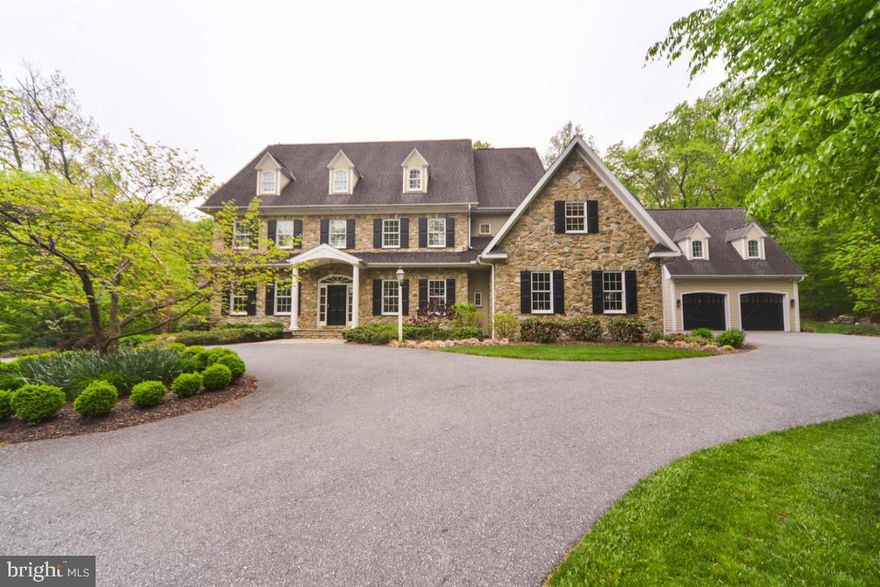 Beautiful custom home that is a must see to appreciate on a 6.2 acre private wooded lot. 5 bedrooms, 4 fireplaces, eat in kitchen with breakfast room, sunroom, exercise room, cherry library with gas fireplace surrounded by tile, elevator & more. Master suite with sitting room, master bath with spa & huge WIC. Carriage house above 2  of 4 car garage & additional generator. See attached features list. Aerial link: http://youtu.be/BTk4kKm1oSE