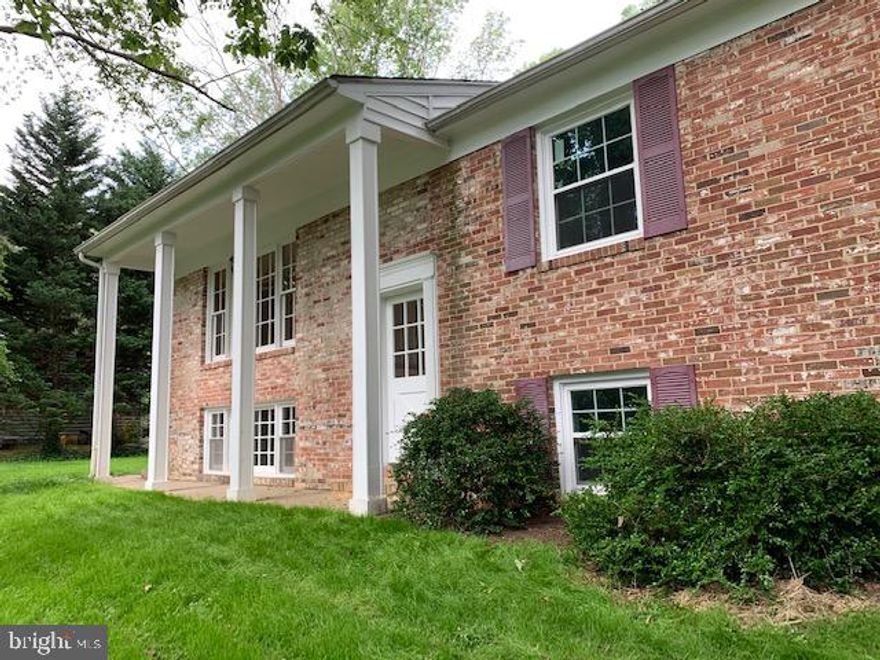 North Shore on the Magothy!  Great Community with Community Beach,  Pavilion, Volley Ball, Basketball, boat ramp, boat docking and lot of fun community activities.  Chesapeake school system.  Split Foyer with 3 bedrooms, living room, dining room and kitchen upstairs, all freshly painted and the bathroom was just beautifully remodeled.  The basement has large family room with wood burning fireplace.  Lots of natural light.  Lots of windows bright and doesn't feel so much like a basement.  There is a full kitchen, bedroom and full bath in basement.  It has for the last 30+ years been used as an in law apartment.  The dividing wall at entrance foyer is being removed but could easily be put up for total privacy for extended family wanting to share the home.  Huge deck off the dining area.  Patio.  Wooded views from the front and back of house and out every window.  Great setting and walking distance to the beach.  Don't miss this opportunity.  It is a great place to live.