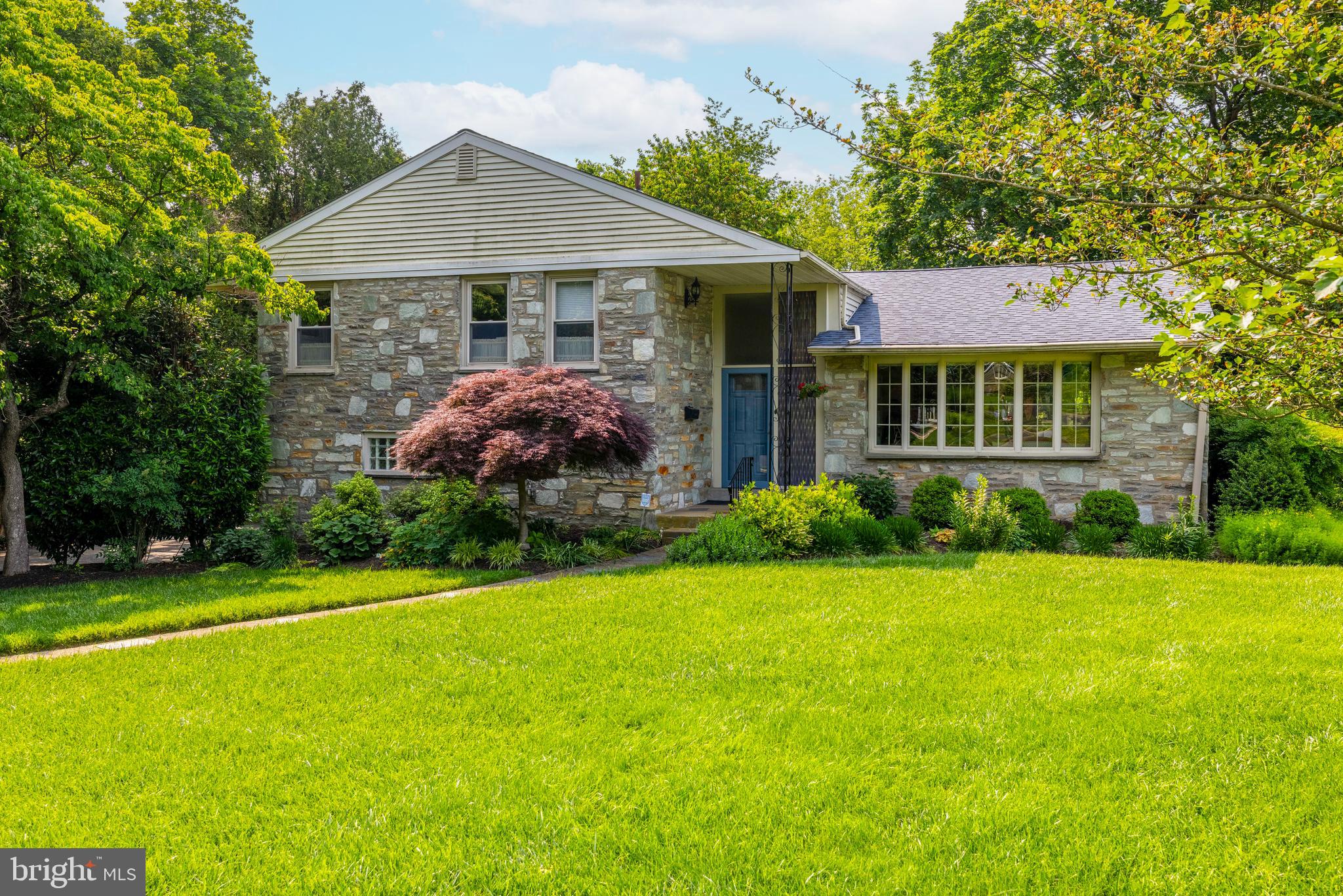 Lovingly maintained by the same owner for the past 40 years, this bright and spacious multi-level home is located in the highly desirable Jenkintown Manor section of Abington Township. Nestled on a beautifully landscaped lot, this well-built residence offers elegant living spaces, updated bathrooms and kitchen, hardwood floors, abundant natural light, and excellent storage throughout. Enter through a large foyer into the inviting living room featuring vaulted ceilings, expansive bow windows, hardwood floors, and recessed lighting. The formal dining room, open to the living area, boasts large windows and sliding glass doors that lead to a tranquil, private patio—perfect for relaxing or entertaining guests. The fabulous kitchen is a chef’s delight, with vaulted ceilings, a skylight, handsome cabinetry, granite countertops, a ceramic tile backsplash and flooring, and all newer stainless steel appliances, including a gas cooktop and double wall oven. A bright breakfast area with a garden window and access to the rear patio completes the space. On the lower level, you’ll find a spacious and elegant family room with a striking stone wood-burning fireplace, a picture window, and custom built-ins. This level also includes a large laundry/mudroom, along with a convenient powder room. Upstairs, the primary suite features a stunning updated bathroom with a walk-in shower and a granite-topped double vanity with ample storage, in addition you will find his & her walk-in closets. Three additional bedrooms and a beautifully updated hall bath with a skylight complete the upper level. The finished basement offers bonus space that includes a cedar closet, hobby room and a dedicated storage area. Additional highlights include a two-car garage, mature landscaping, a whole house generator, and thoughtful updates throughout—making this a truly special home in a coveted neighborhood. The property is located within 10 minutes walk toe Alverthrope Park, one of the most treasured parks in the township and within a short driving distance to shops restaurants and train station of Jenkintown Borough and the surrounding areas.